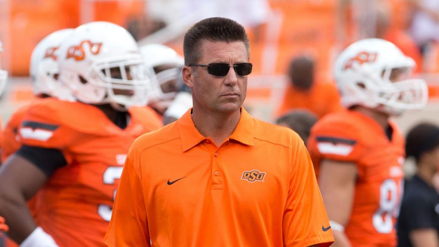 Sep 14, 2013; Stillwater, OK, USA; Oklahoma State Cowboys head coach Mike Gundy during practice before the game against the Lamar Cardinals at Boone Pickens Stadium. Mandatory Credit: Richard Rowe-USA TODAY Sports