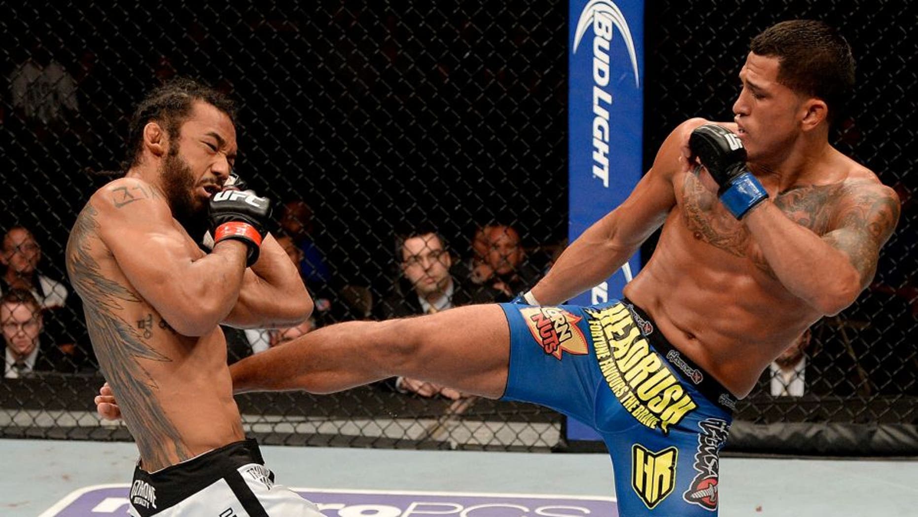 MILWAUKEE, WI - AUGUST 31: (R-L) Anthony 'Showtime' Pettis kicks Benson Henderson in their UFC lightweight championship bout at BMO Harris Bradley Center on August 31, 2013 in Milwaukee, Wisconsin. (Photo by Jeff Bottari/Zuffa LLC/Zuffa LLC via Getty Images)