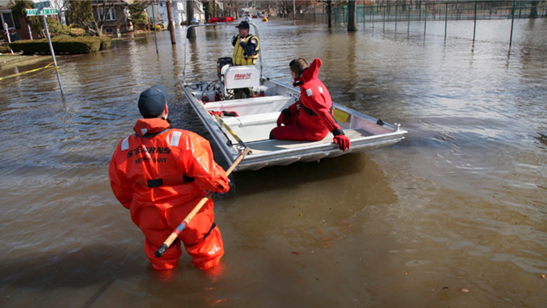 March 12: Paterson, N.J., firefighters make their way onto Totowa Avenue to evacuate residents that need assistance in Paterson, N.J.