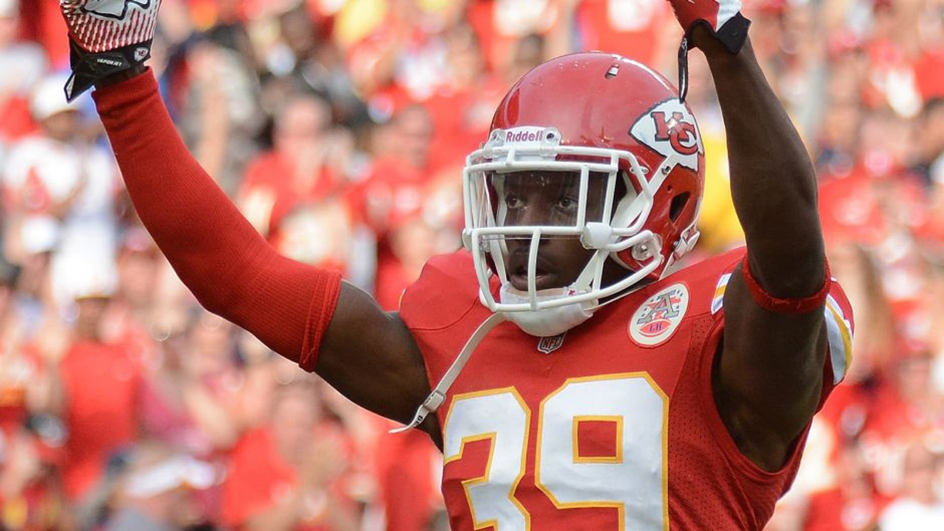 Oct 20, 2013; Kansas City, MO, USA; Kansas City Chiefs defensive back Husain Abdullah (39) motions to the crowd during the first half of the game against the Houston Texans at Arrowhead Stadium. The Chiefs won 17-16. Mandatory Credit: Denny Medley-USA TODAY Sports