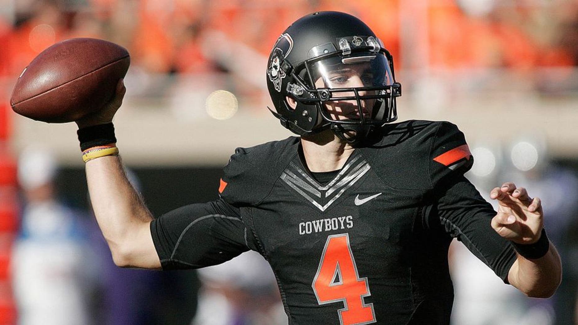 STILLWATER, OK - OCTOBER 5: Quarterback J.W. Walsh #4 of the Oklahoma State Cowboys looks to throw against the Kansas State Wildcats October 5, 2013 at Boone Pickens Stadium in Stillwater, Oklahoma. The Cowboys defeated the Wildcats 33-29. (Photo by Brett Deering/Getty Images)