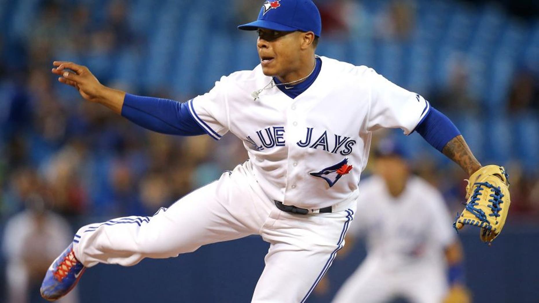 TORONTO, CANADA - SEPTEMBER 26: Marcus Stroman #54 of the Toronto Blue Jays delivers a pitch during MLB game action against the Baltimore Orioles on September 26, 2014 at Rogers Centre in Toronto, Ontario, Canada. (Photo by Tom Szczerbowski/Getty Images)