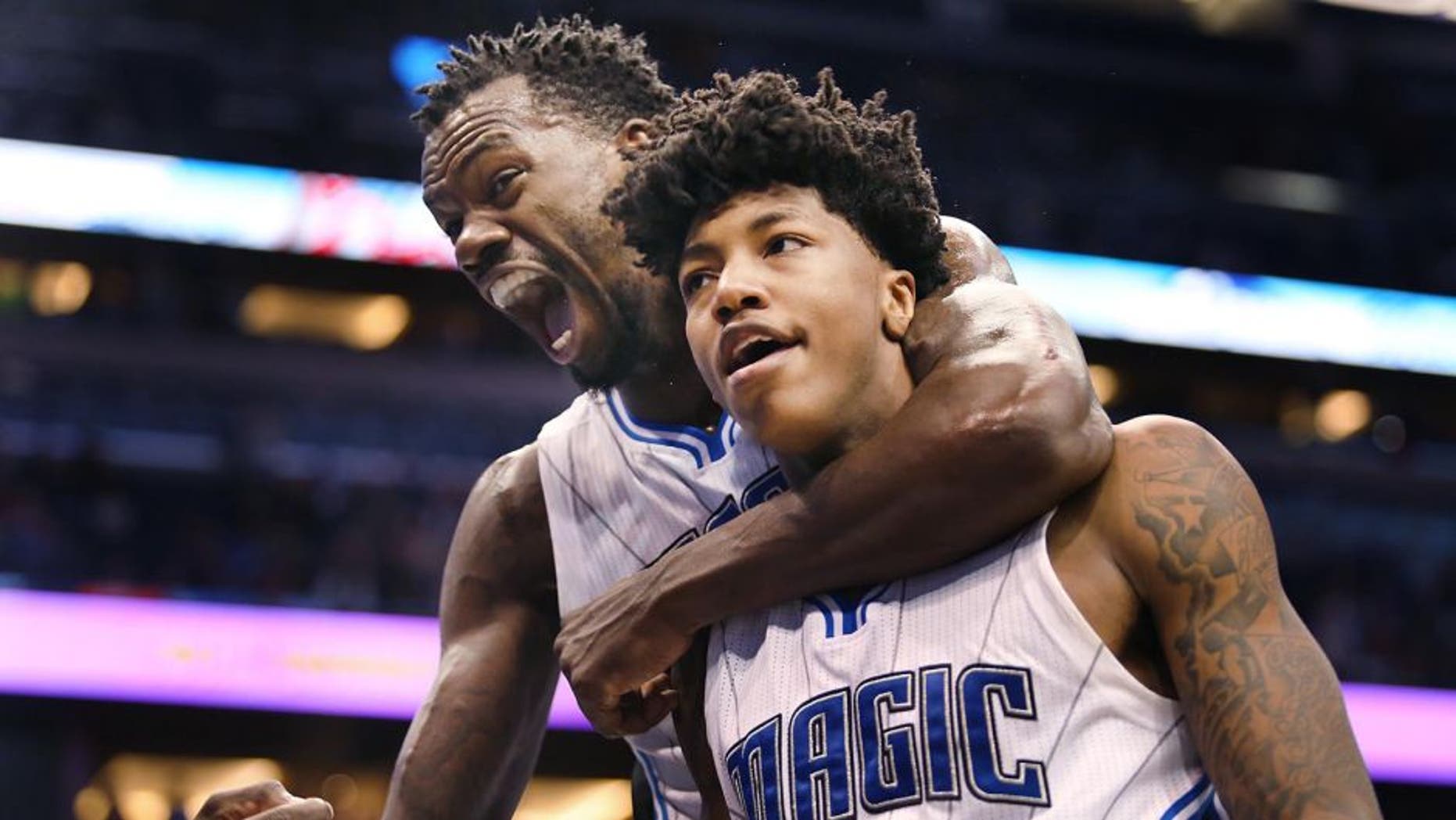 Orlando Magic forward Dewayne Dedmon, left, screams in celebration as he hugs guard Elfrid Payton, who scored during the fourth quarter of an NBA basketball game against the Sacramento Kings on Friday, March 6, 2015, in Orlando, Fla. The Magic won 119-114. (AP Photo/Orlando Sentinel, Stephen M. Dowell)