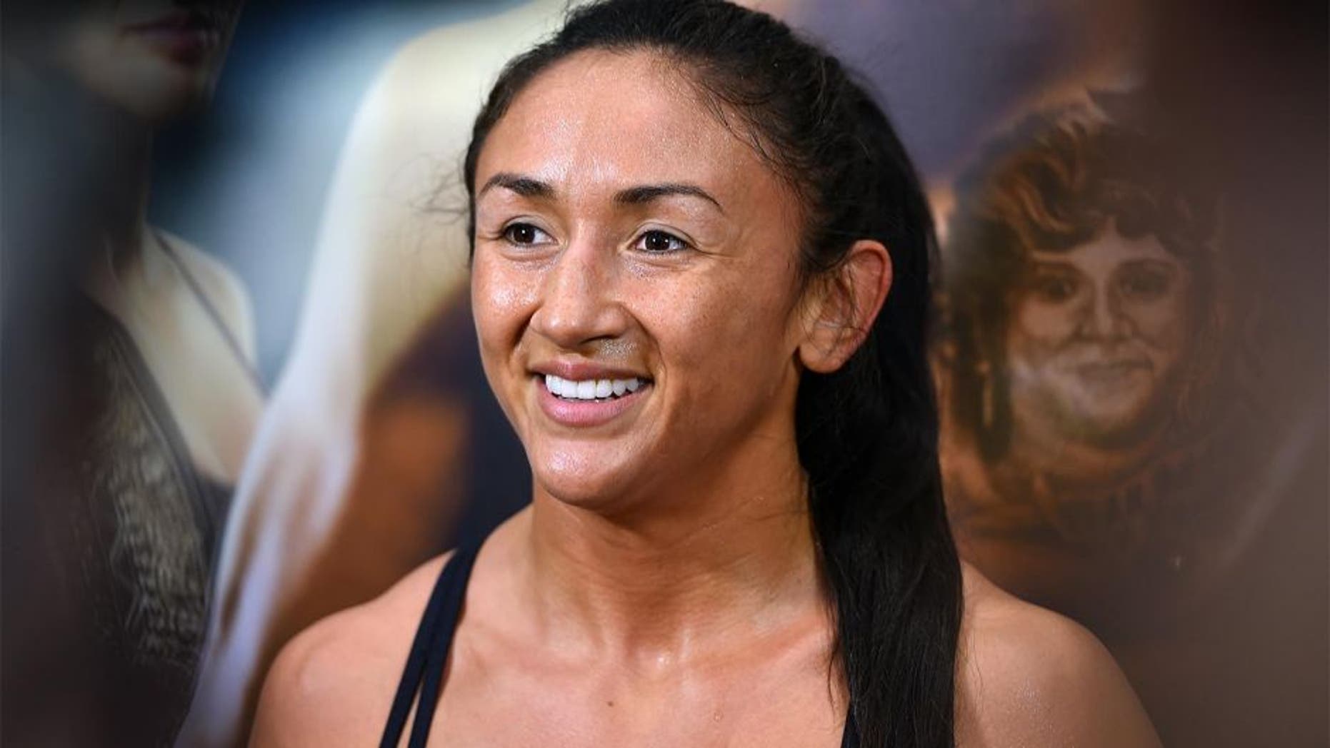 DALLAS, TX - MARCH 11: UFC women's strawweight champion Carla Esparza interacts with media after an open training session for fans and media at the Hilton Anatole Hotel on March 11, 2015 in Dallas, Texas. (Photo by Josh Hedges/Zuffa LLC/Zuffa LLC via Getty Images)