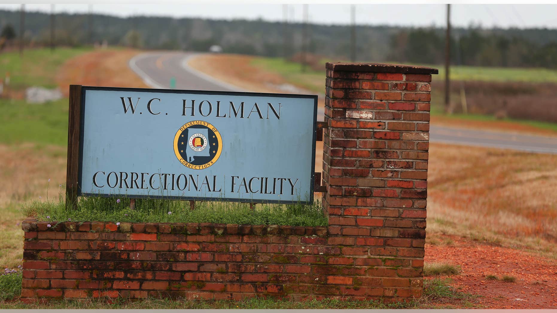 The sign to The William C. Holman Correctional Facility in Atmore, Ala., is displayed on Saturday March 12, 2016.