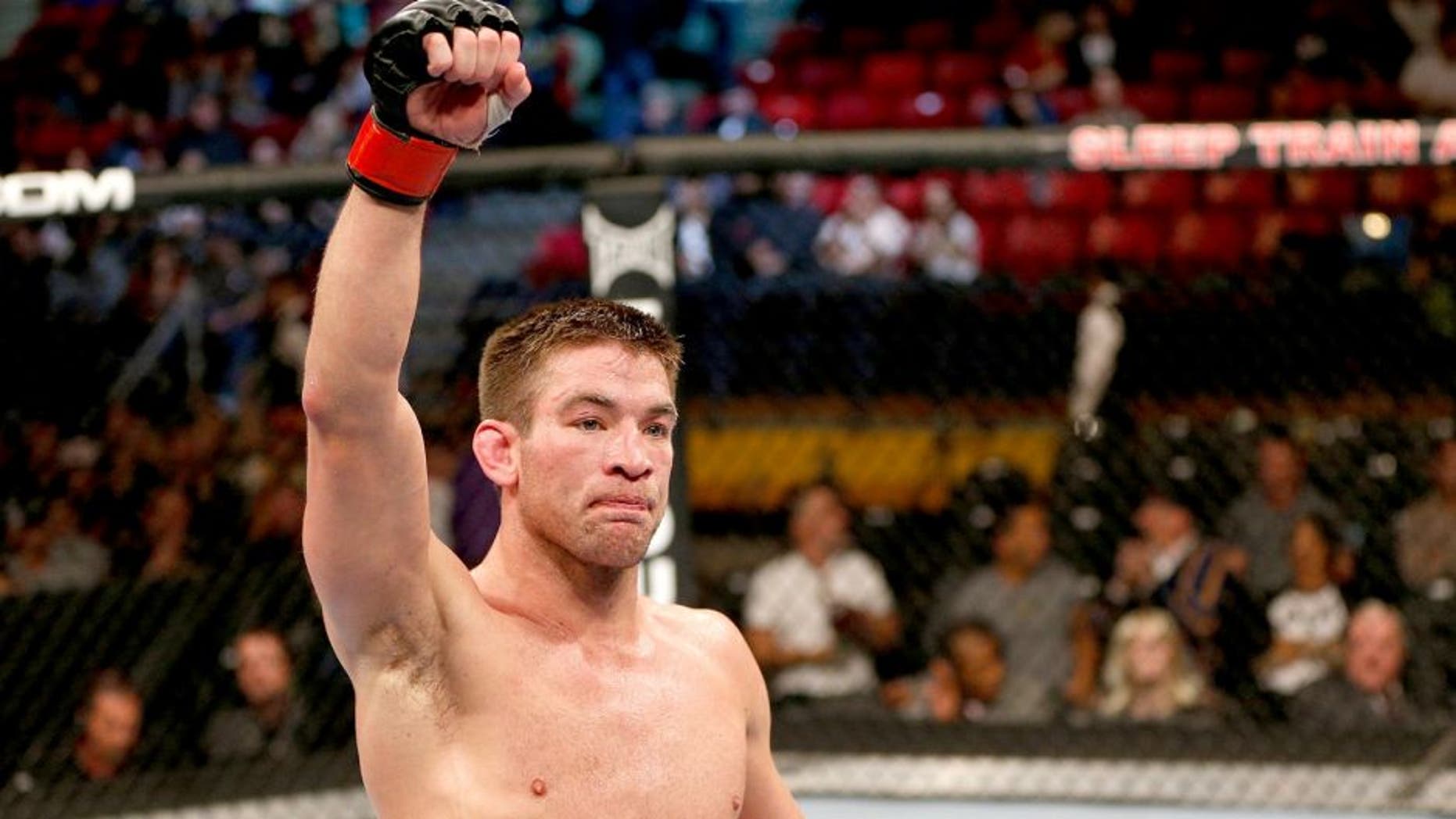 SACRAMENTO, CA - DECEMBER 14: Sam Stout reacts to his victory over Cody McKenzie in their lightweight bout during the UFC on FOX event at Sleep Train Arena on December 14, 2013 in Sacramento, California. (Photo by Josh Hedges/Zuffa LLC/Zuffa LLC via Getty Images)