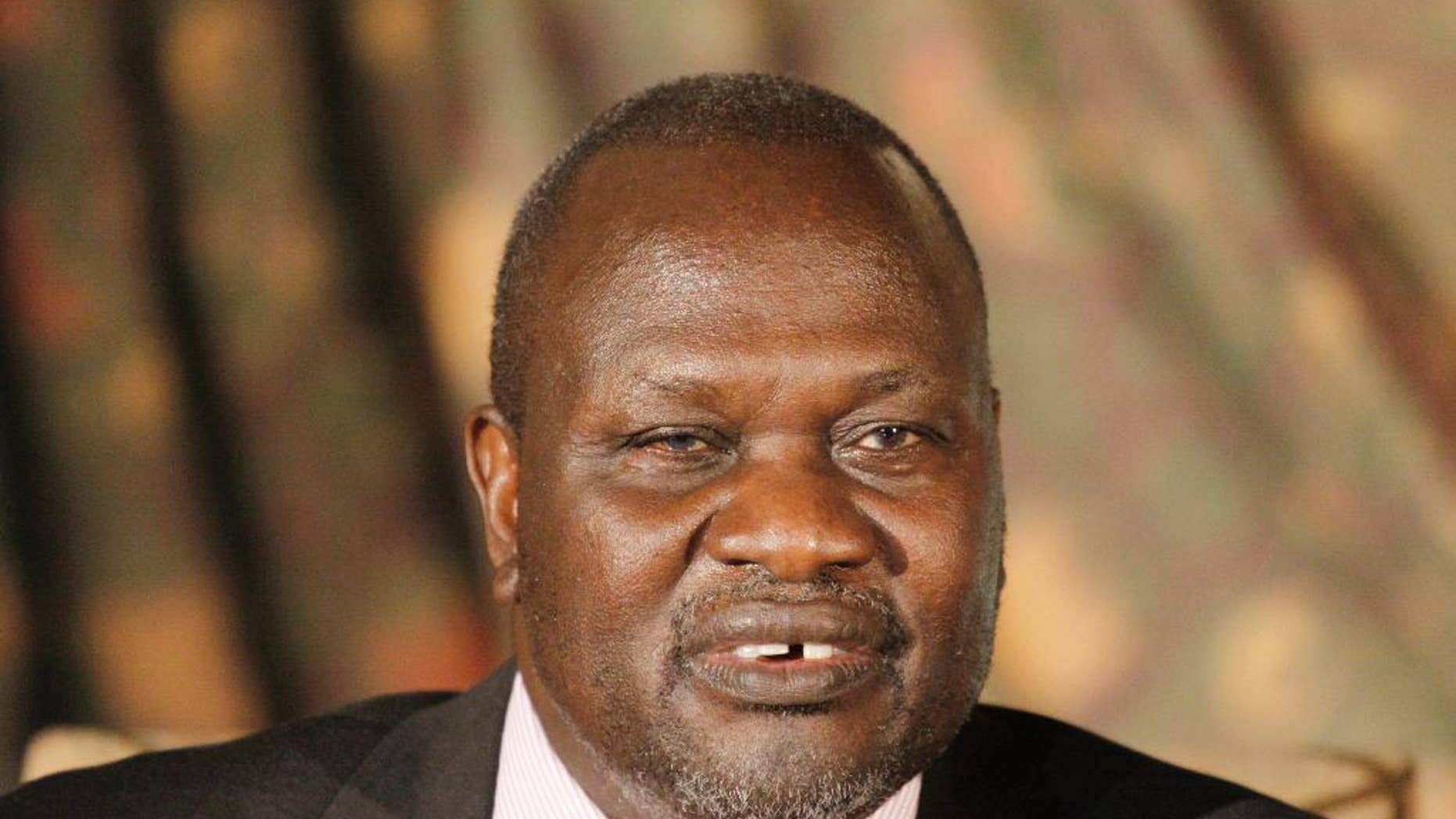 FILE--In this Wednesday, July 8, 2015 file photo, South Sudan rebel leader Riek Machar addresses journalists during a news conference in Nairobi, Kenya. South Sudan's rebel leader is accusing President Salva Kiir of wanting to turn the country into an "ethnic state" for his Dinka group. Riek Machar's statement, obtained by The Associated Press, Sept. 26, 2016, accuses the government of pushing ethnic groups into fighting. (AP Photo/Khalil Senosi, File)