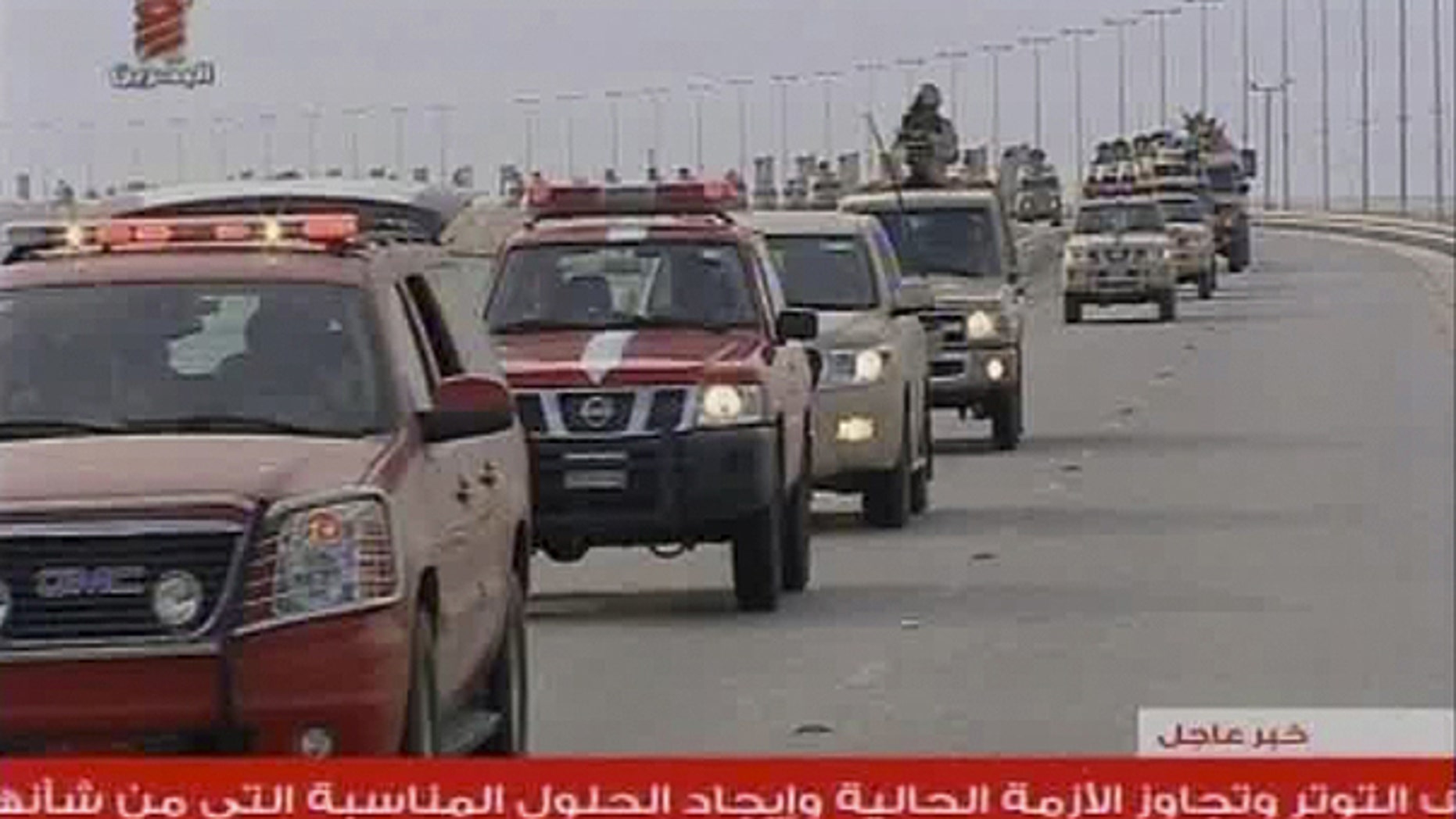 March 14: This screen grab taken from Bahrain TV shows troops arriving in Bahrain from Saudi Arabia.