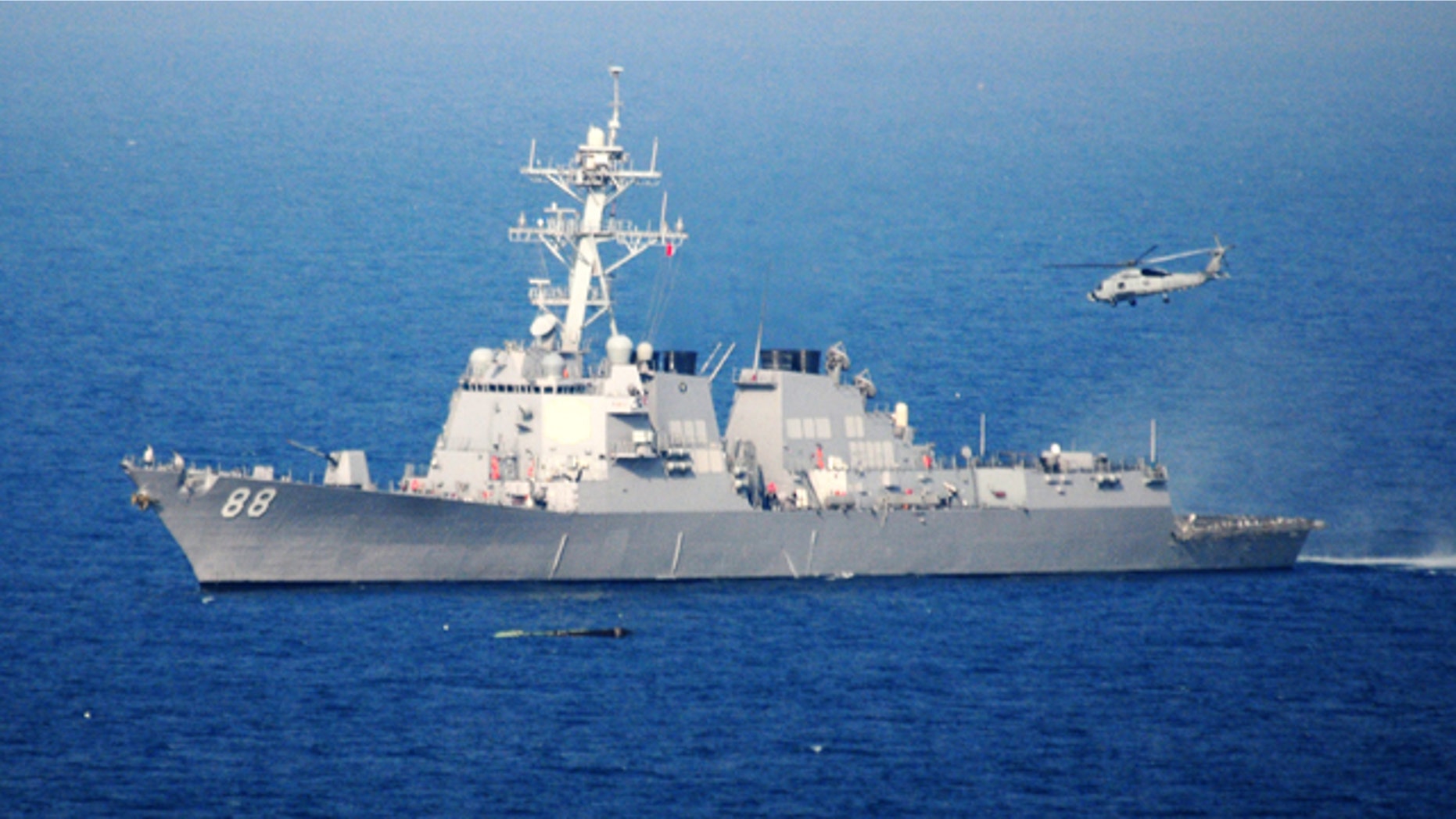 An HH-60H Sea Hawk helicopter lifts off Sunday, March 13, 2011 from the guided-missile destroyer USS Preble (DDG 88) after refueling. The helicopter is conducting a search of debris fields in the waters near Sendai, Japan.