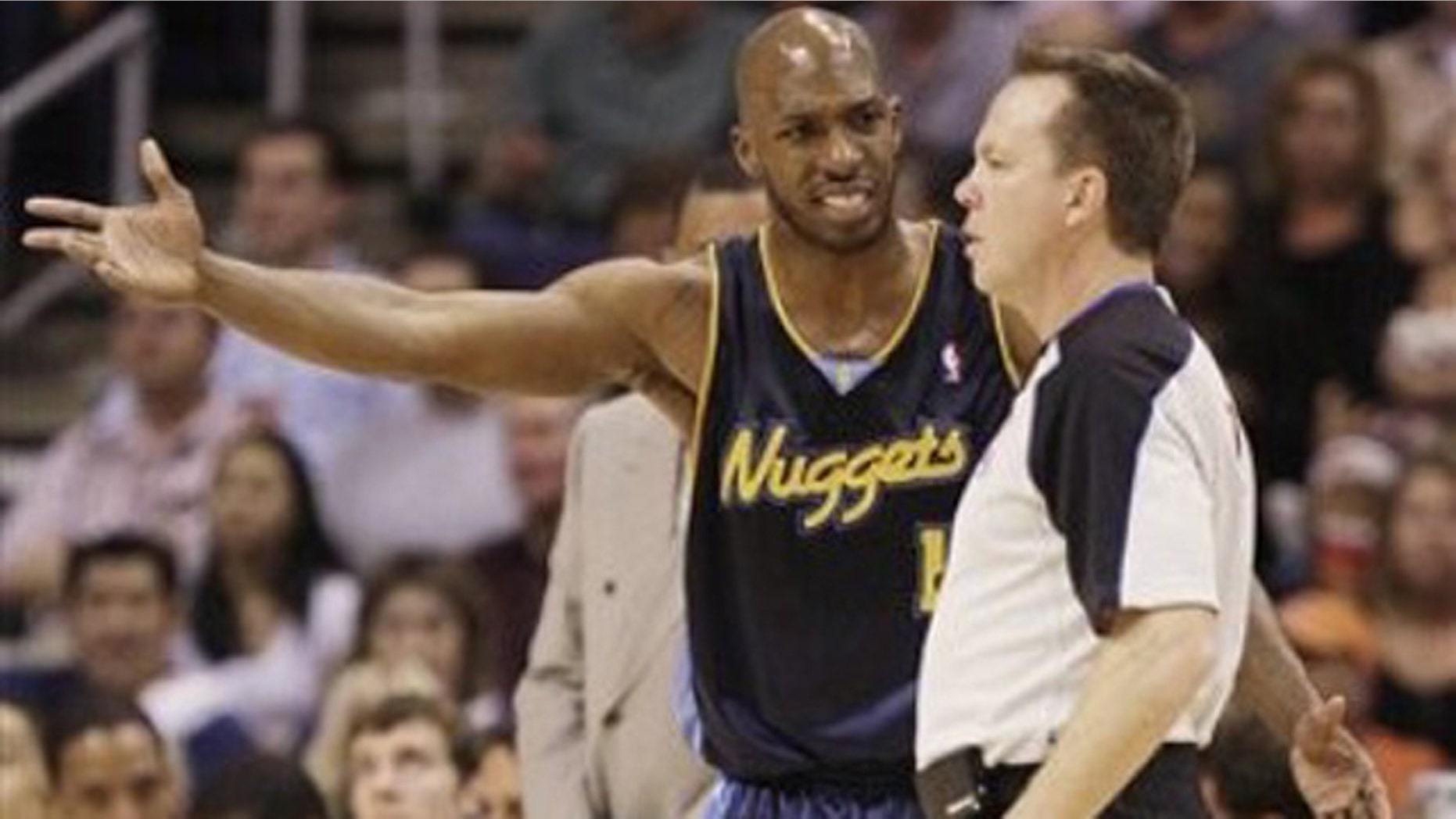 Denver Nuggets' Chauncey Billups, left, voices his opinion to referee Bill Spooner during the first quarter of an NBA basketball game against the Phoenix Suns Tuesday, April 13, 2010, in Phoenix.