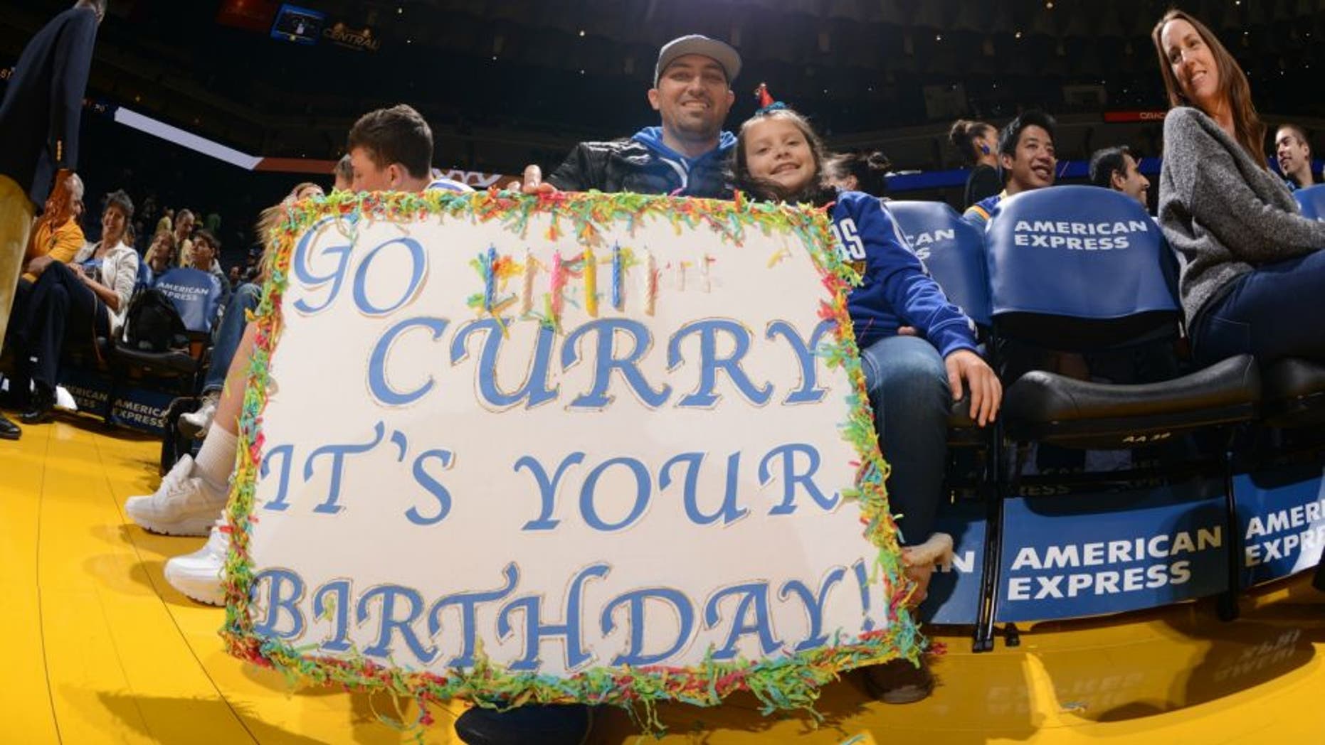 OAKLAND, CA - MARCH 14: Some fans hold up a happy birthday sign for Stephen Curry #30 of the Golden State Warriors on March 14, 2016 at Oracle Arena in Oakland, California. NOTE TO USER: User expressly acknowledges and agrees that, by downloading and or using this photograph, user is consenting to the terms and conditions of Getty Images License Agreement. Mandatory Copyright Notice: Copyright 2016 NBAE (Photo by Noah Graham/NBAE via Getty Images)
