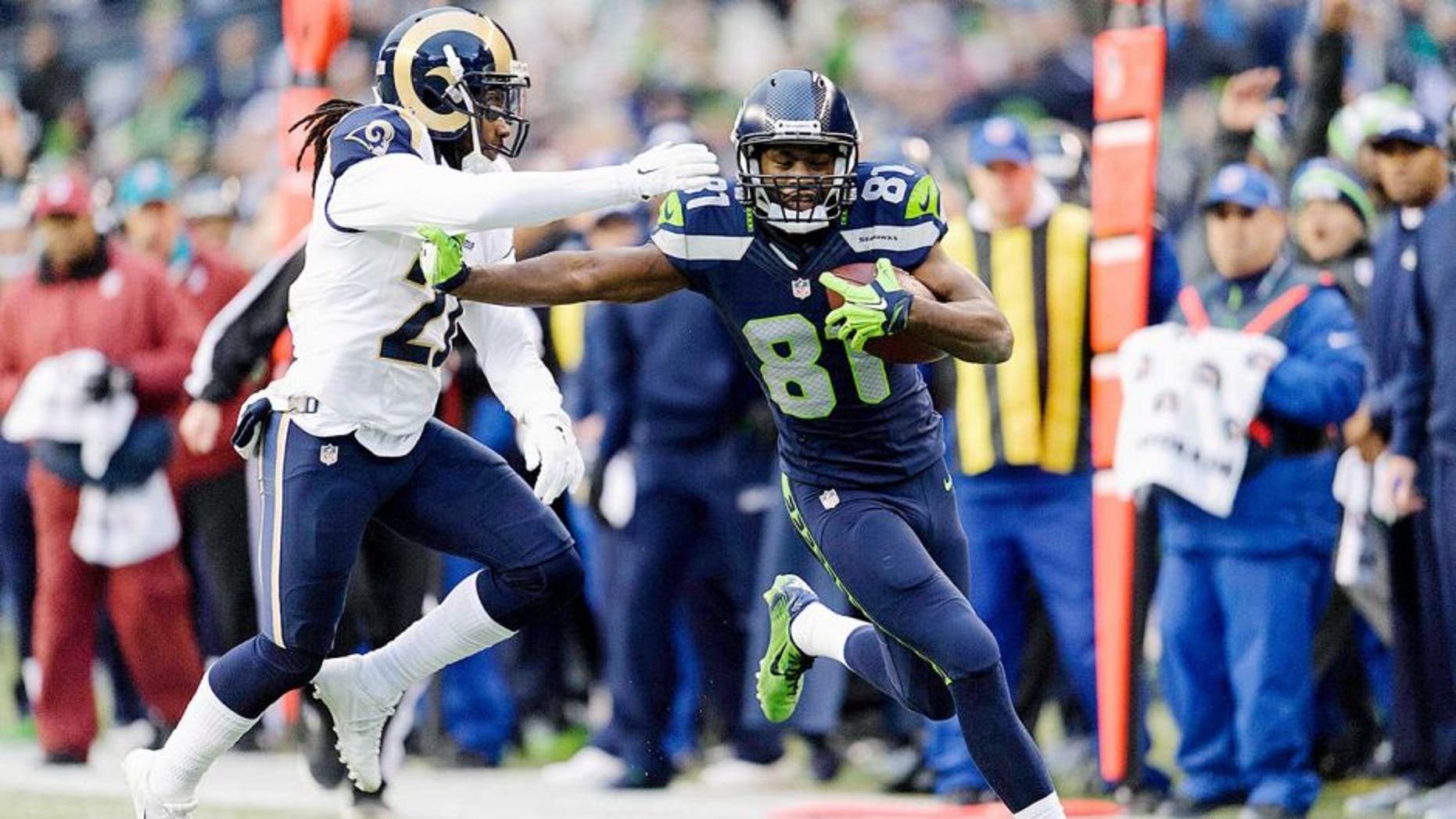 Dec 28, 2014; Seattle, WA, USA; Seattle Seahawks wide receiver Kevin Norwood (81) stiff arms St. Louis Rams cornerback Janoris Jenkins (21) during the second half at CenturyLink Field. Seattle defeated St. Louis 20-6. Mandatory Credit: Steven Bisig-USA TODAY Sports