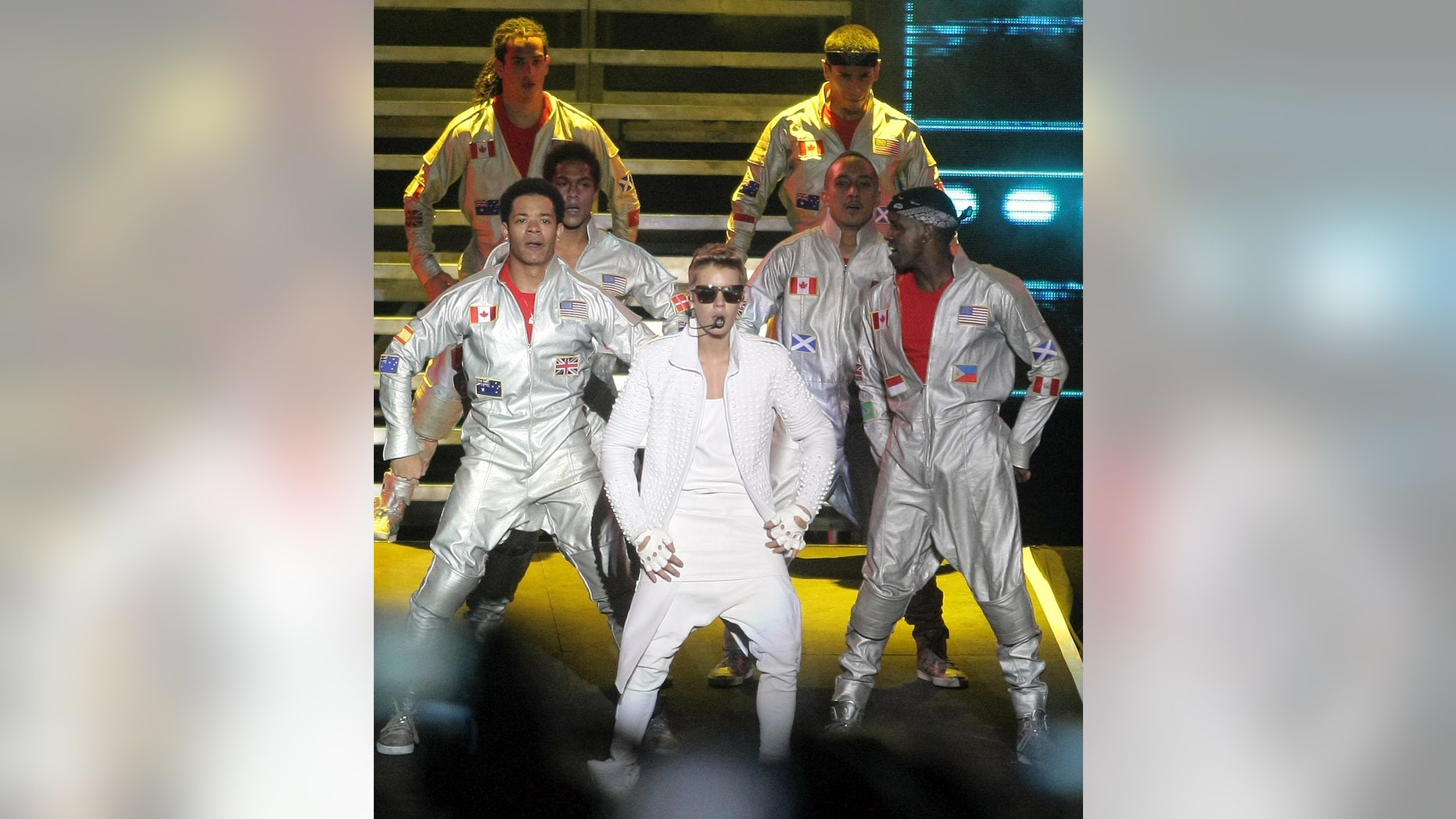 Canada's pop star Justin Bieber performs in concert during his Believe world tour in Buenos Aires, Argentina, Sunday, Nov. 10, 2013. Bieber's manager says food poisoning made him quit the stage during the concert, drawing boos from a huge crowd in River Plate stadium. (AP Photo/Pablo Molina, DyN)