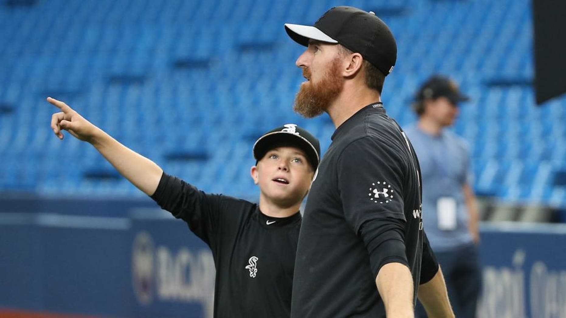 TORONTO, CANADA - MAY 25: Drake the son of Adam LaRoche #25 of the Chicago White Sox points to the roof as it opens during batting practice before the start of MLB game action against the Toronto Blue Jays on May 25, 2015 at Rogers Centre in Toronto, Ontario, Canada. (Photo by Tom Szczerbowski/Getty Images)