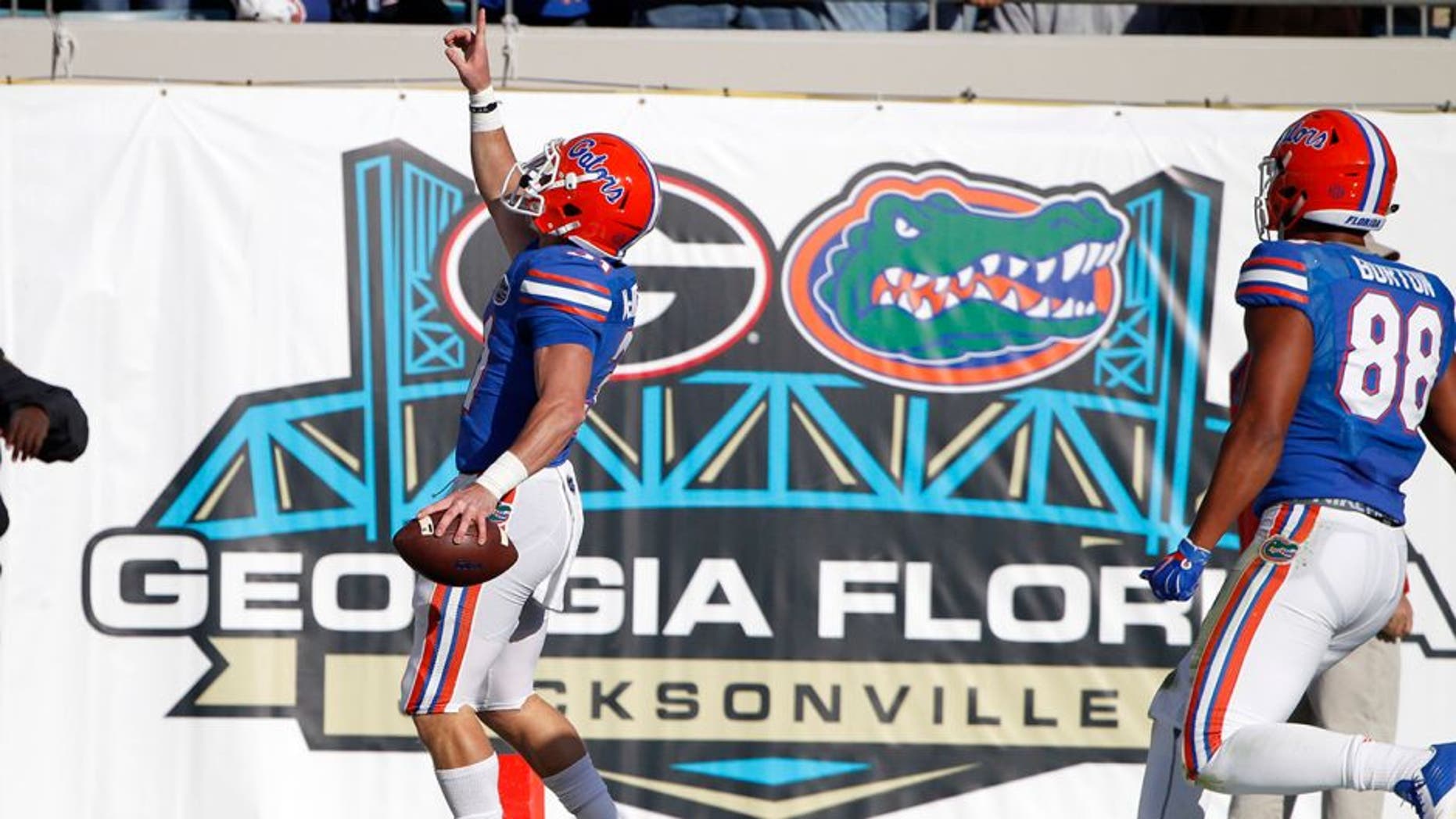 Nov 1, 2014; Jacksonville, FL, USA; Florida Gators field goal holder Michael McNeely (31) runs the ball in for a touchdown during the first half against the Georgia Bulldogs at EverBank Field. Mandatory Credit: Kim Klement-USA TODAY Sports