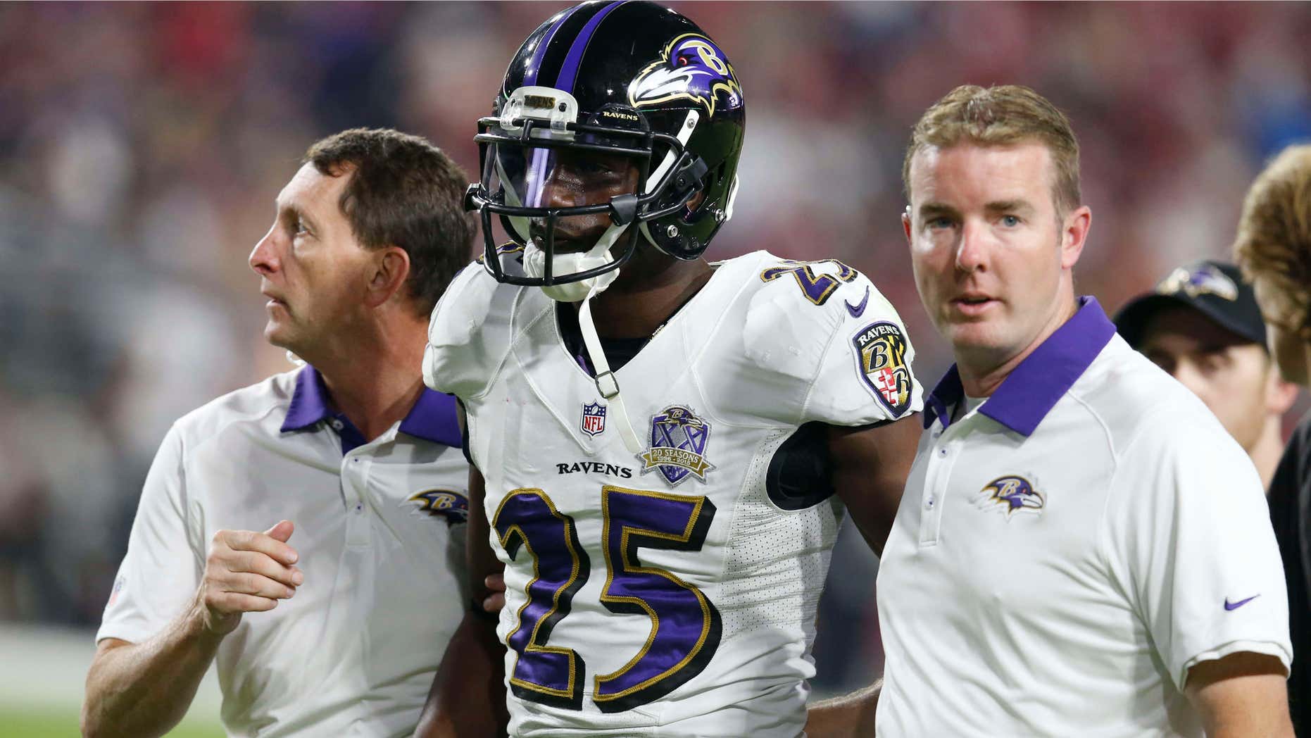 FILE - This Oct. 26, 2015, file photo shows Baltimore Ravens cornerback Tray Walker (25) during the second half of an NFL football game in Glendale, Ariz.