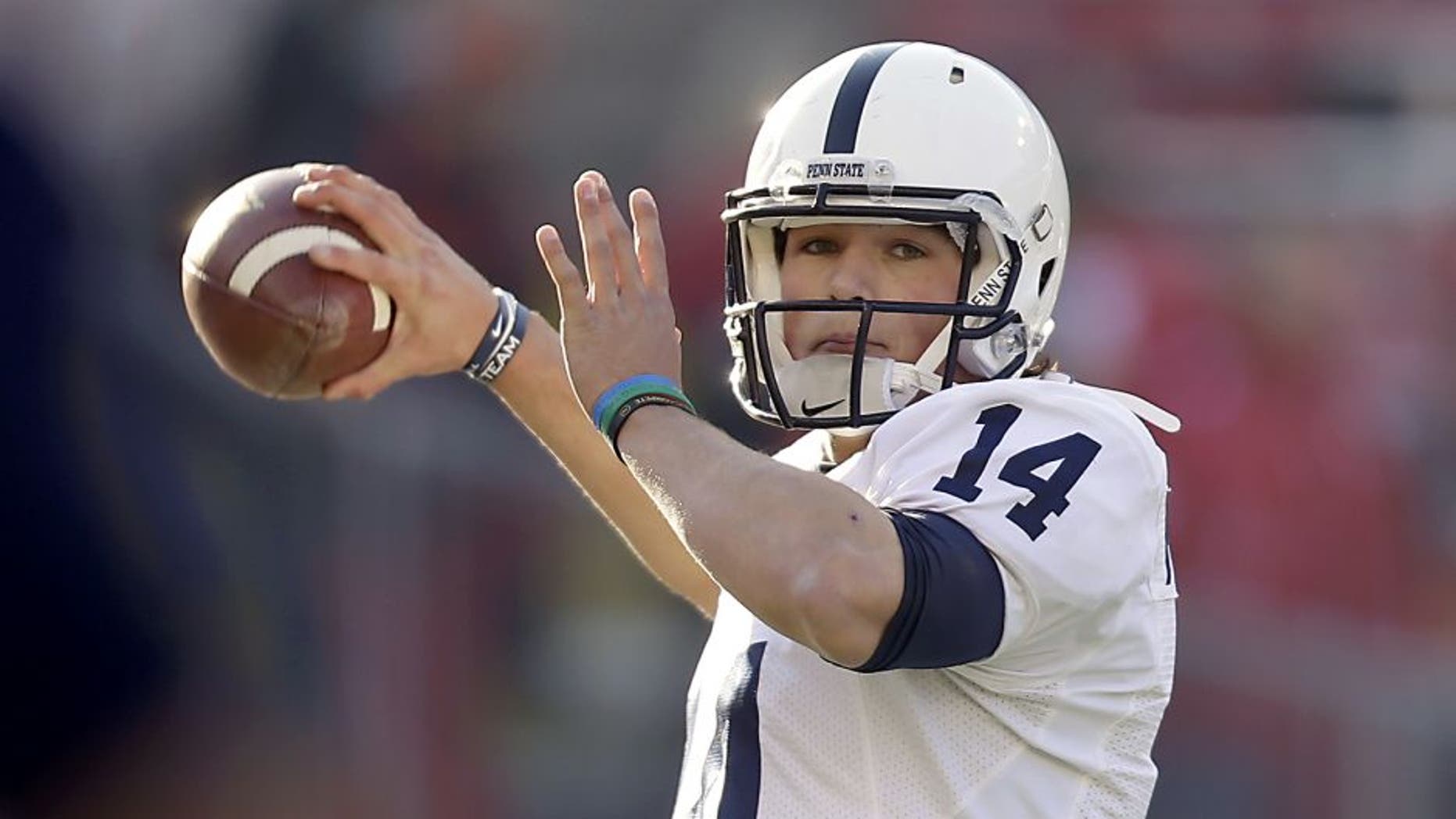 MADISON, WI - NOVEMBER 30: Christian Hackenberg #14 of the Penn State Nittany Lions runs through some pre game drills before the game against the Wisconsin Badgers at Camp Randall Stadium on November 30, 2013 in Madison, Wisconsin. (Photo by Mike McGinnis/Getty Images)