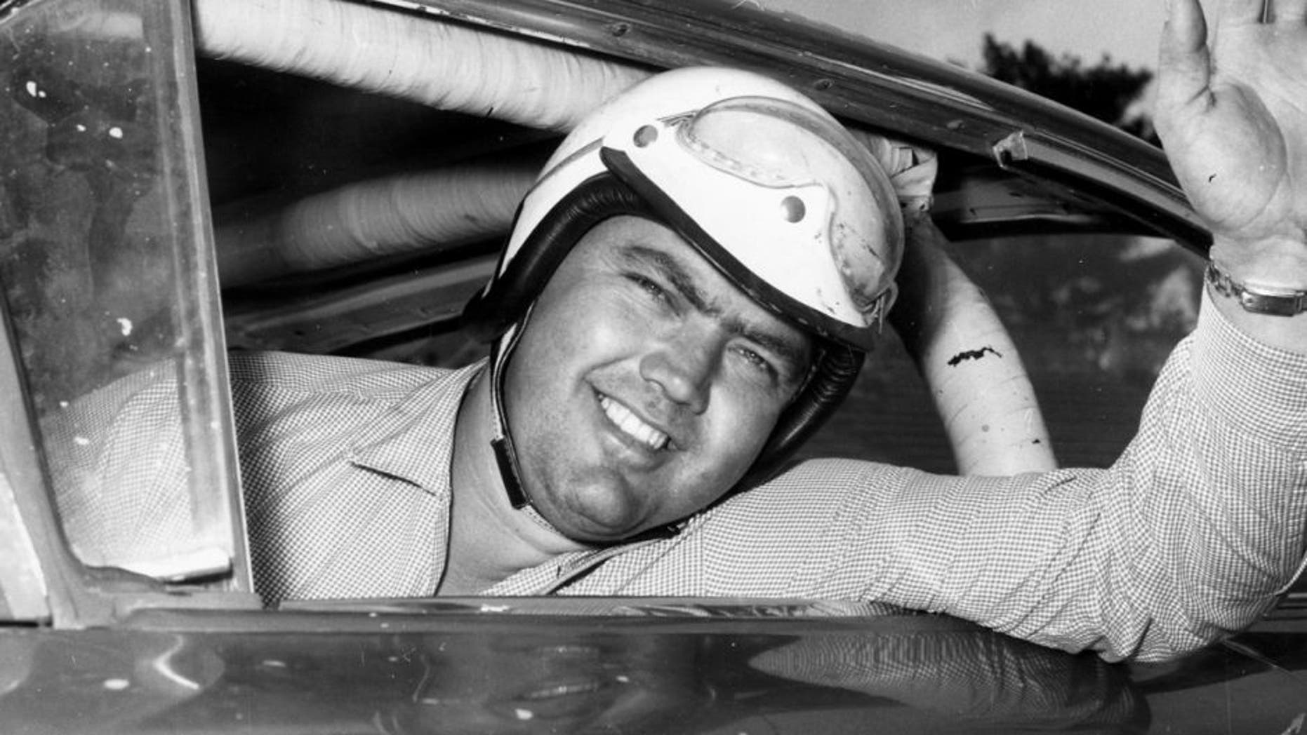 1959: Junior Johnson looks out his car window before a race. Johnson racked up 50 wins during his NASCAR Cup Series driving career, being named one of the organizationâs 50 Greatest Drivers. (Photo by: RacingOne/Getty Images) *** Local Caption *** Junior Johnson