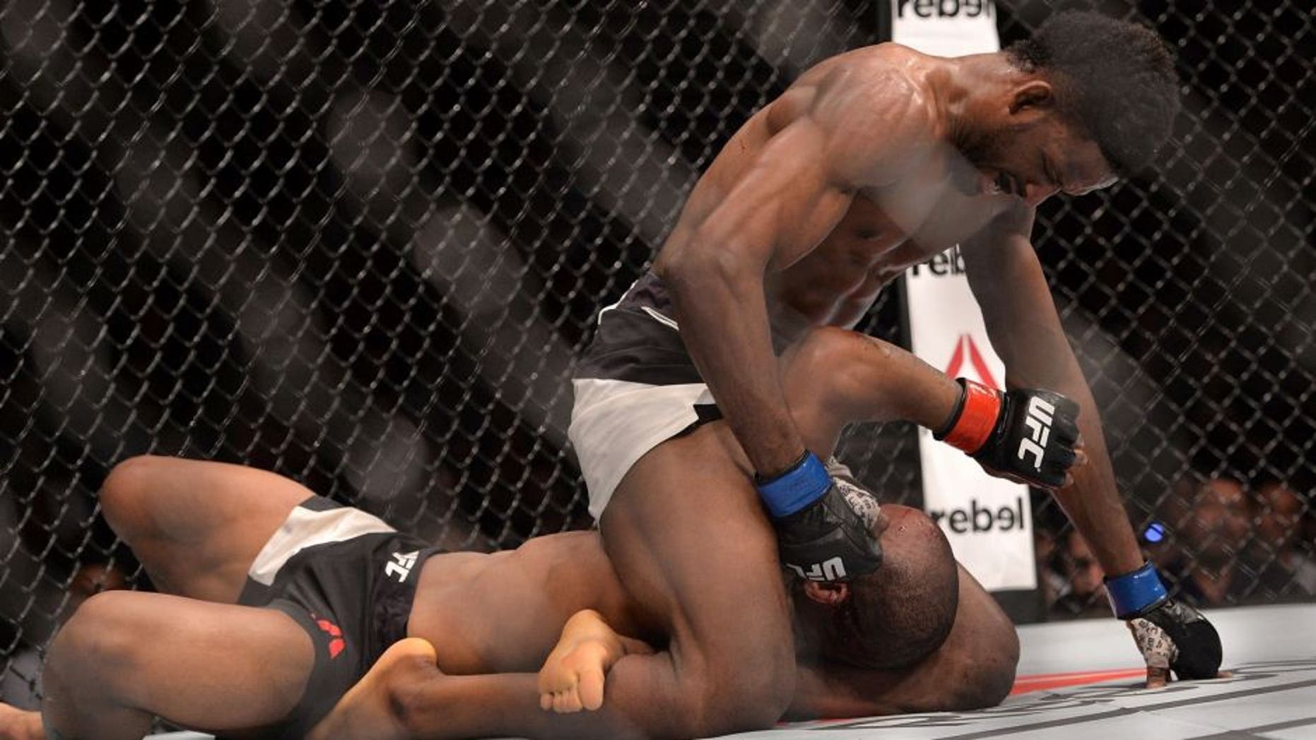 BRISBANE, AUSTRALIA - MARCH 20: Neil Magny dominates against Hector Lombard during their UFC Welterweight Bout at UFC Brisbane on March 20, 2016 in Brisbane, Australia. (Photo by Bradley Kanaris/Getty Images)