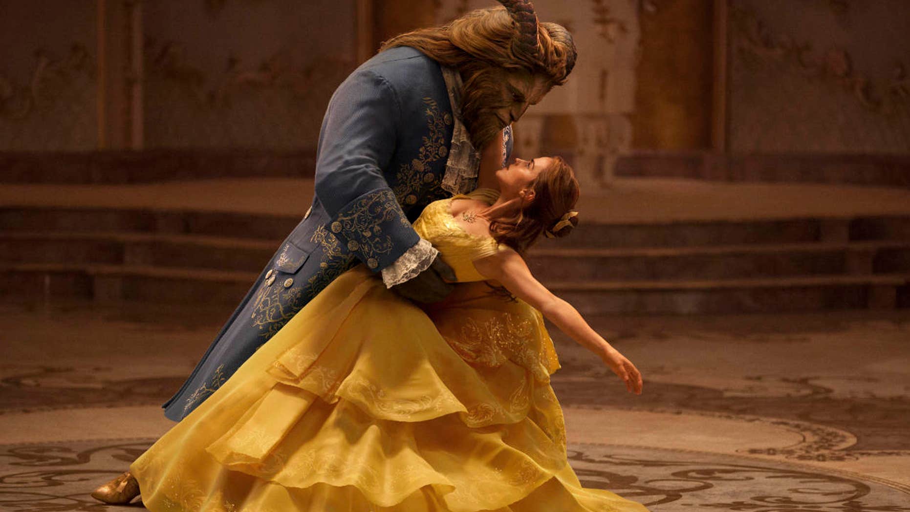 This image released by Disney shows Dan Stevens as The Beast, left, and Emma Watson as Belle in a live-action adaptation of the animated classic "Beauty and the Beast."
