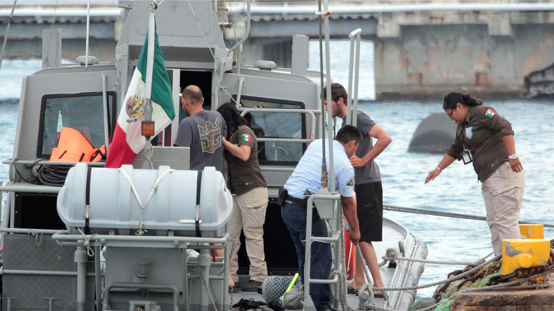 March 19, 2016: Mexican Navy personnel help Cuban migrants after being rescued in Cozumel, Mexico.