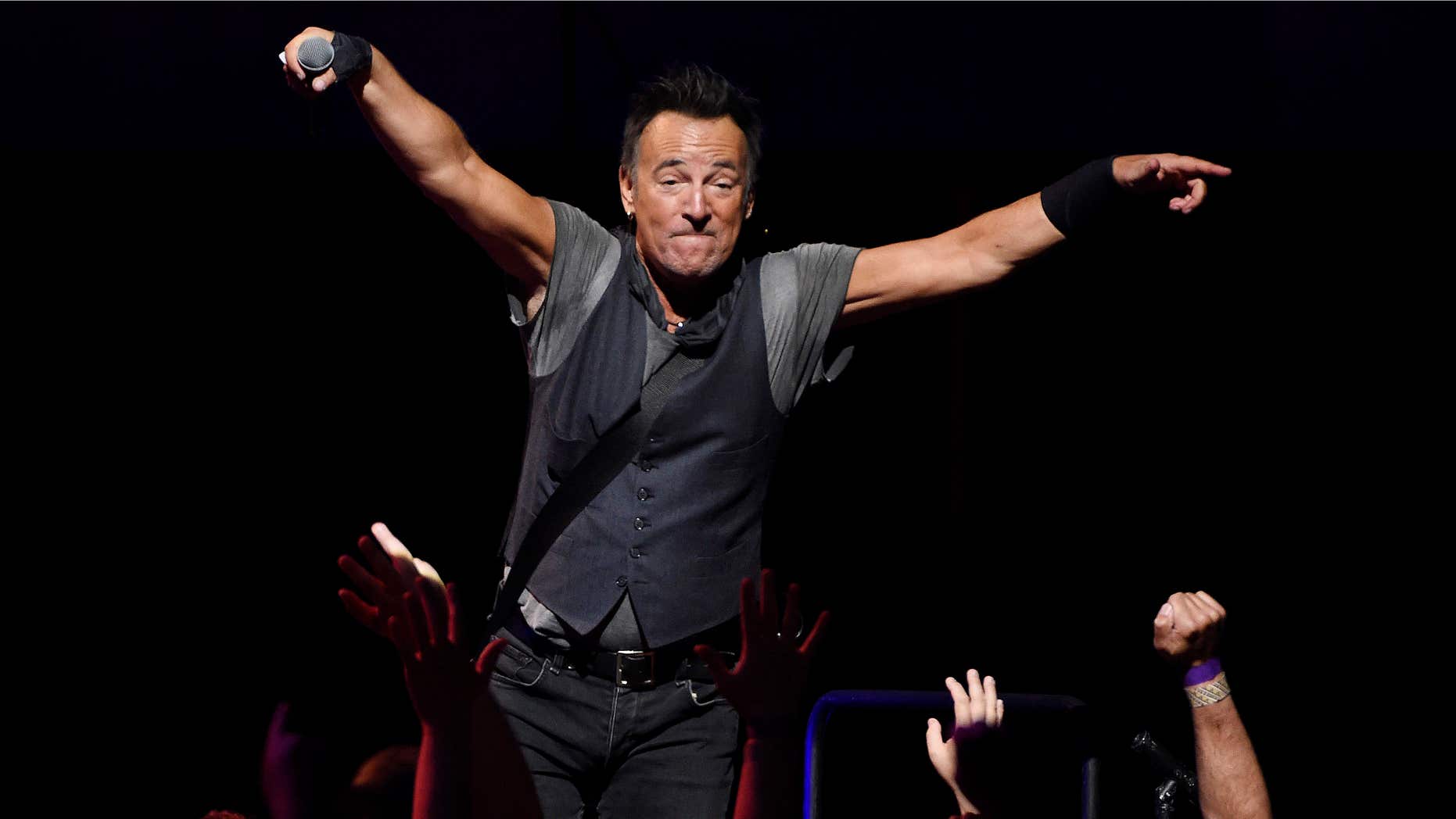 Bruce Springsteen interacts with the crowd during his concert with the E Street Band at the Los Angeles Sports Arena on Tuesday, March 15, 2016, in Los Angeles.