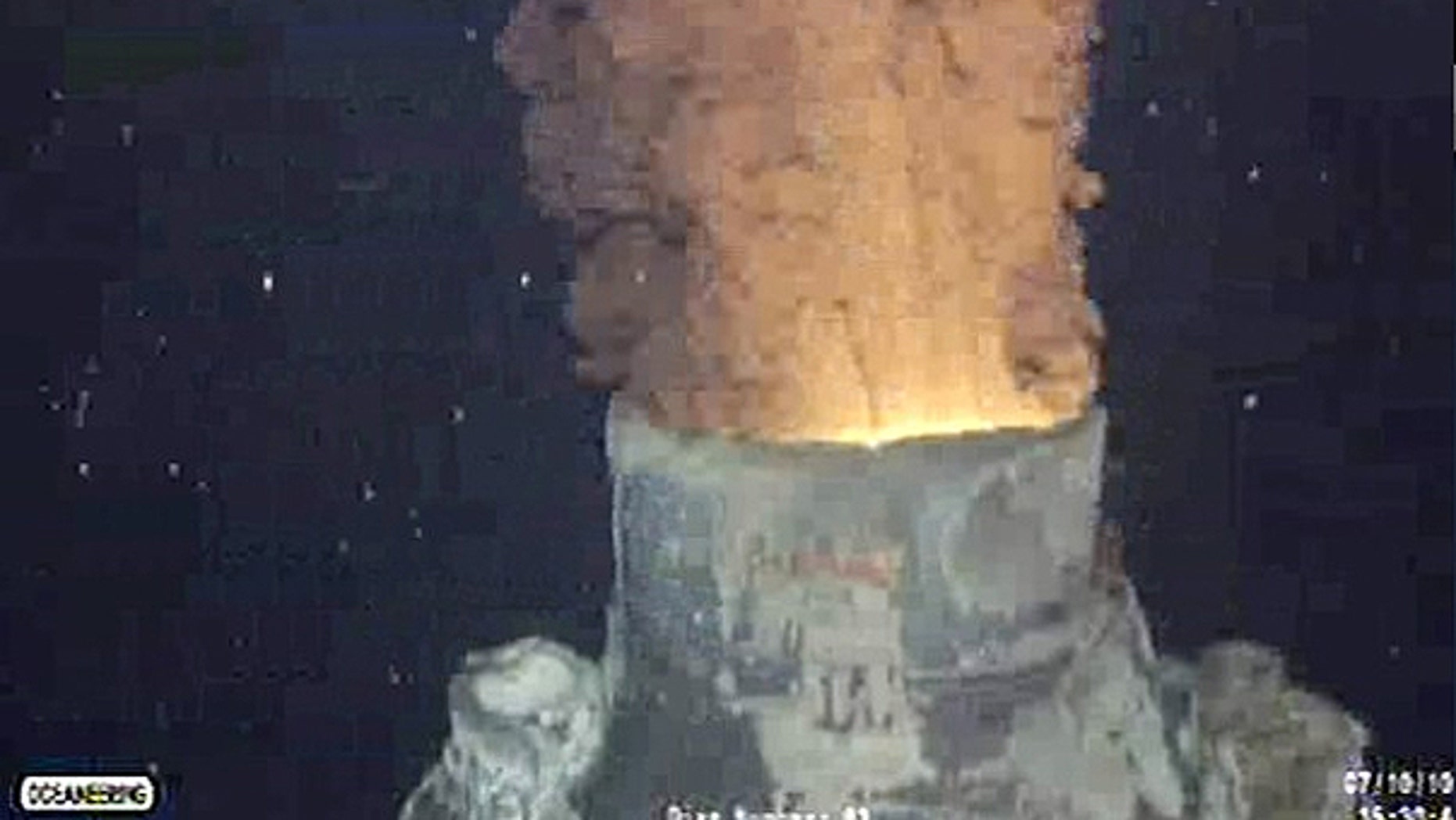 Oil and gas continues to leak from BP's Gulf of Mexico well after the oil containment cap was removed from so it could be replaced with a bigger cap, in the Gulf of Mexico, in this frame grab captured from a BP live video feed.
