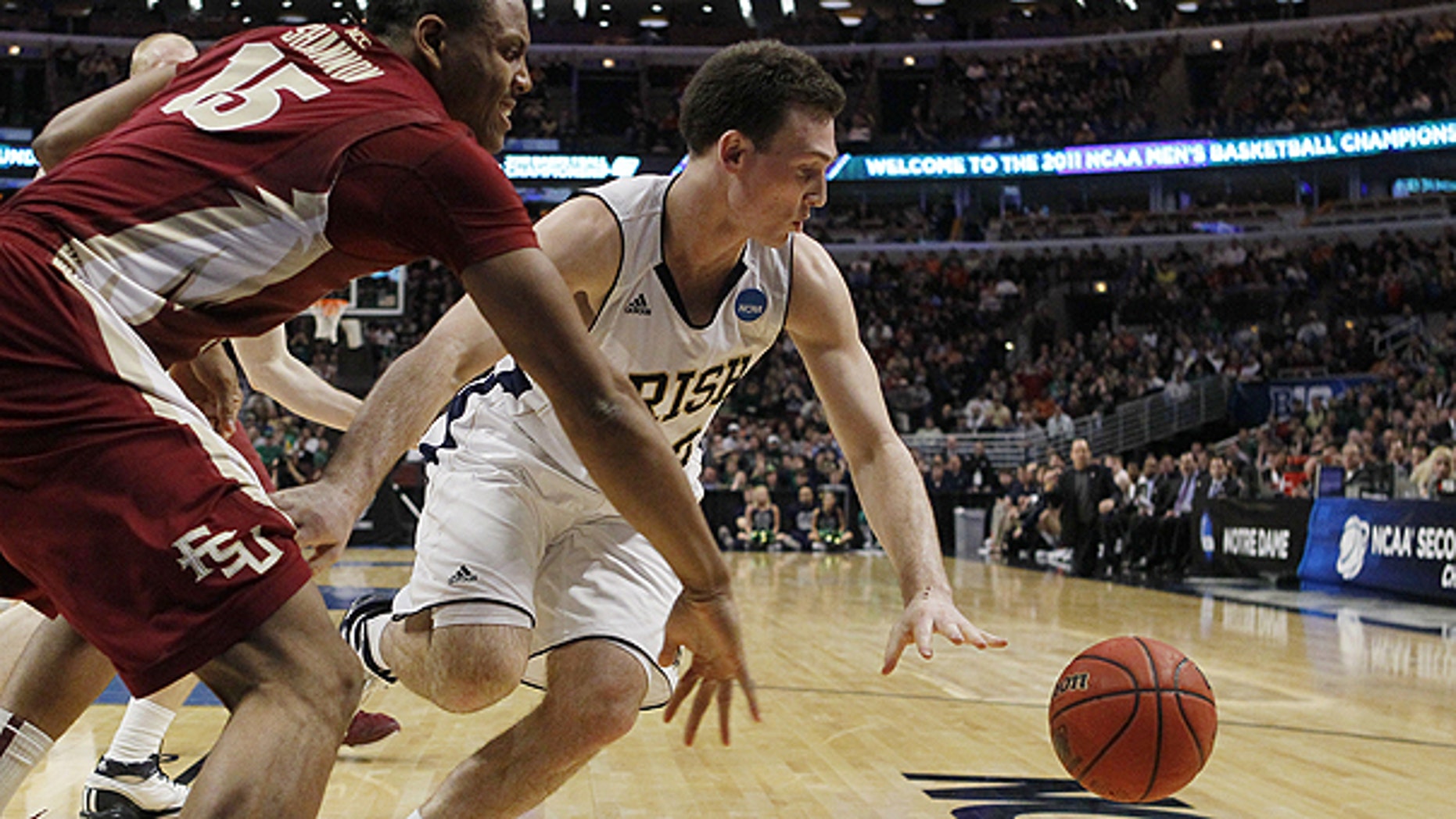March 20: Notre Dame guard Ben Hansbrough and Florida State forward Terrance Shannon, left, chase a loose ball in the first half of a third-round NCAA Southwest Regional tournament college basketball game in Chicago.