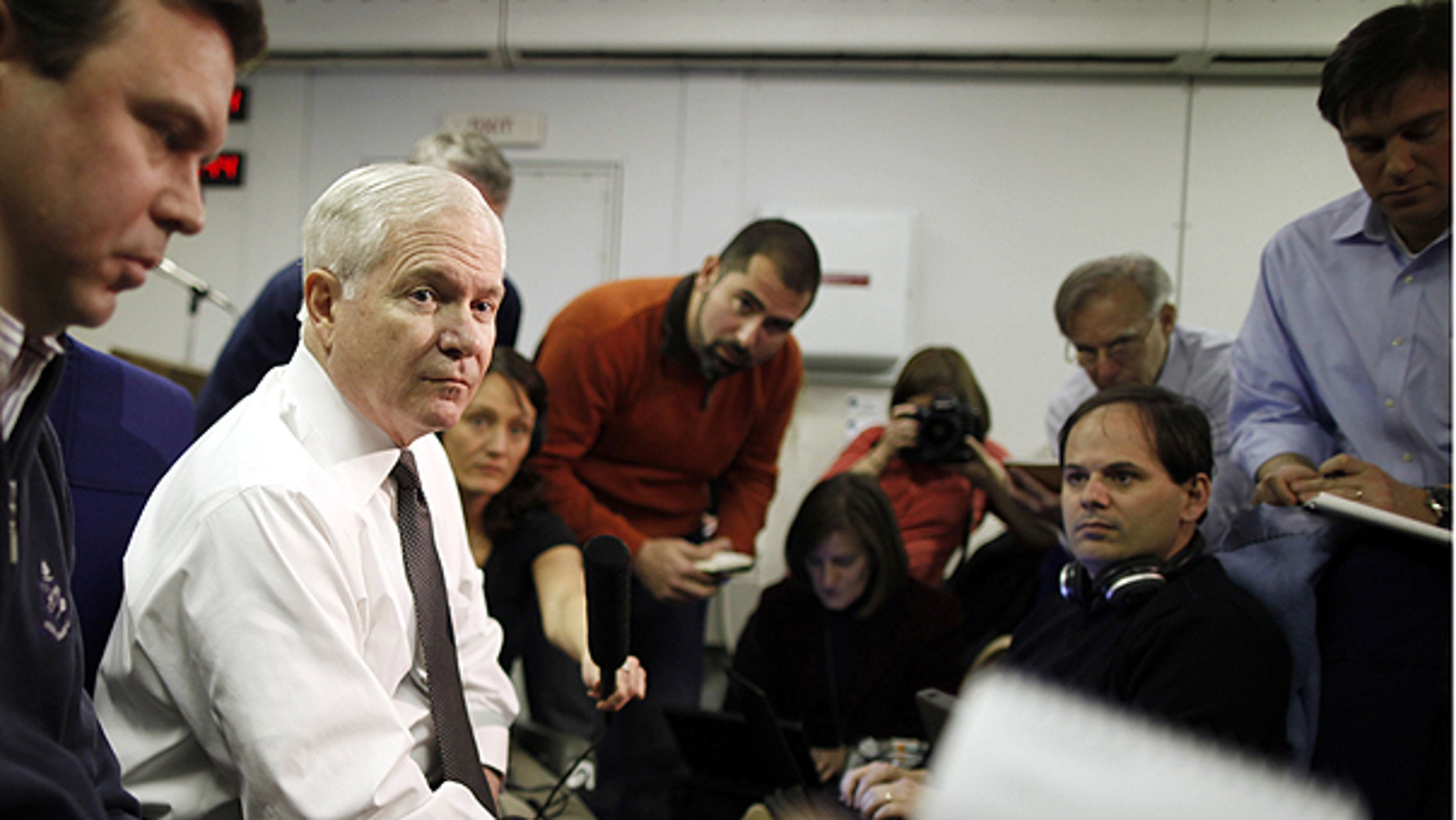 March 20: U.S. Defense Secretary Robert Gates speaks about Libya as he briefs reporters on board a military plane en route to St. Petersburg, Russia.