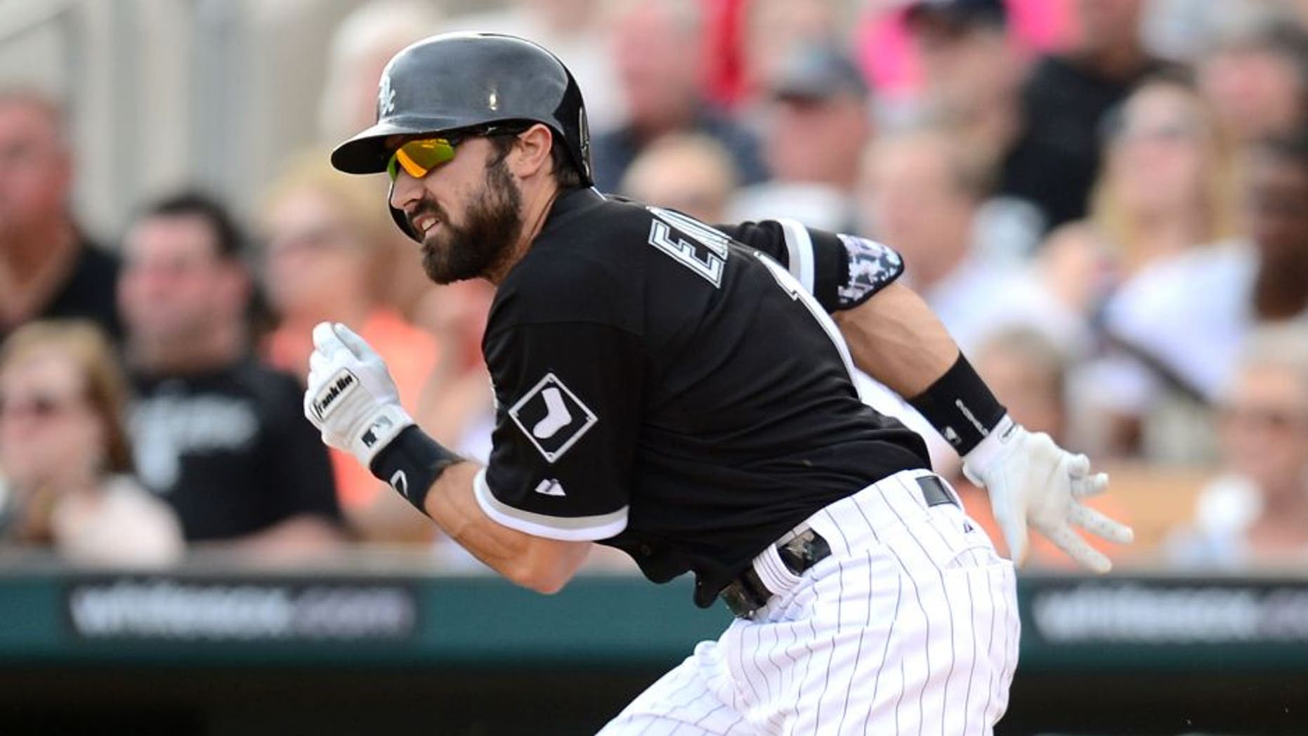 Mar 12, 2015; Phoenix, AZ, USA; Chicago White Sox center fielder Adam Eaton (1) runs to first base against the San Francisco Giants at Camelback Ranch. Mandatory Credit: Joe Camporeale-USA TODAY Sports