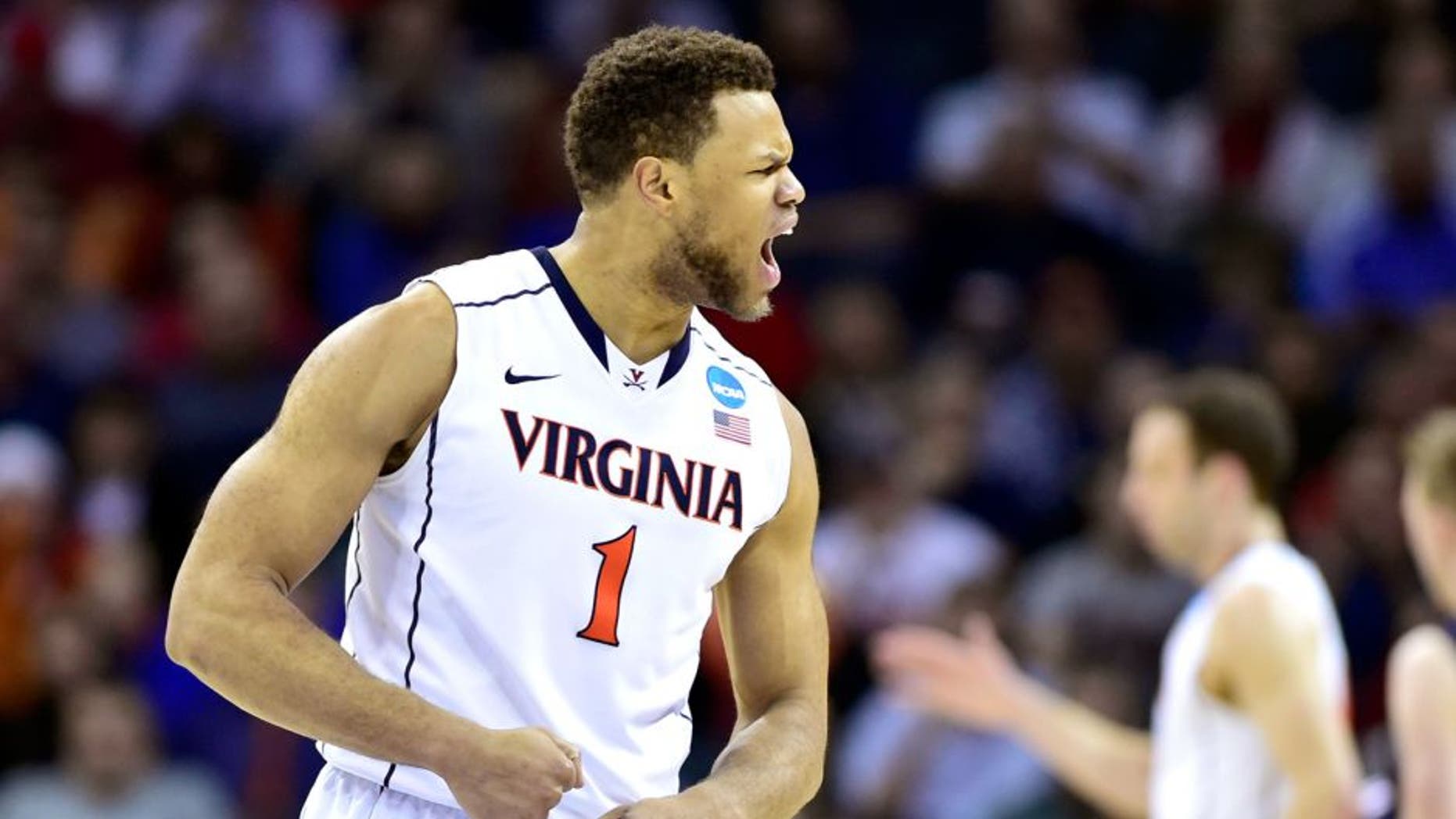Mar 20, 2015; Charlotte, NC, USA; Virginia Cavaliers guard Justin Anderson (1) reacts to a play during the second half against the Belmont Bruins in the second round of the 2015 NCAA Tournament at Time Warner Cable Arena. Mandatory Credit: Bob Donnan-USA TODAY Sports