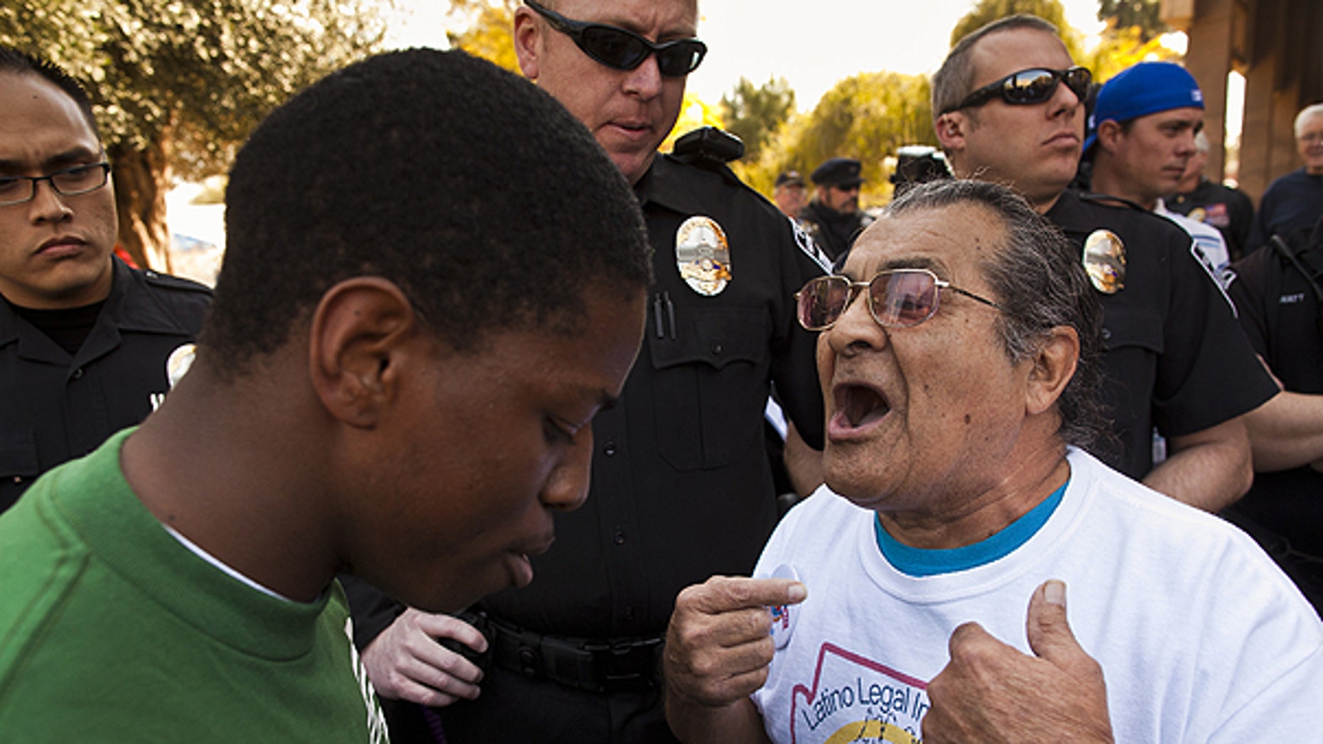 Feb. 22: arvis Johnson, leftt, , a supporter of immigrants' rights and Arthur Olivas, right, a supporter of Sen Russell Pearce's anti-immigrant bills, debate at the State Capitol in Phoenix.