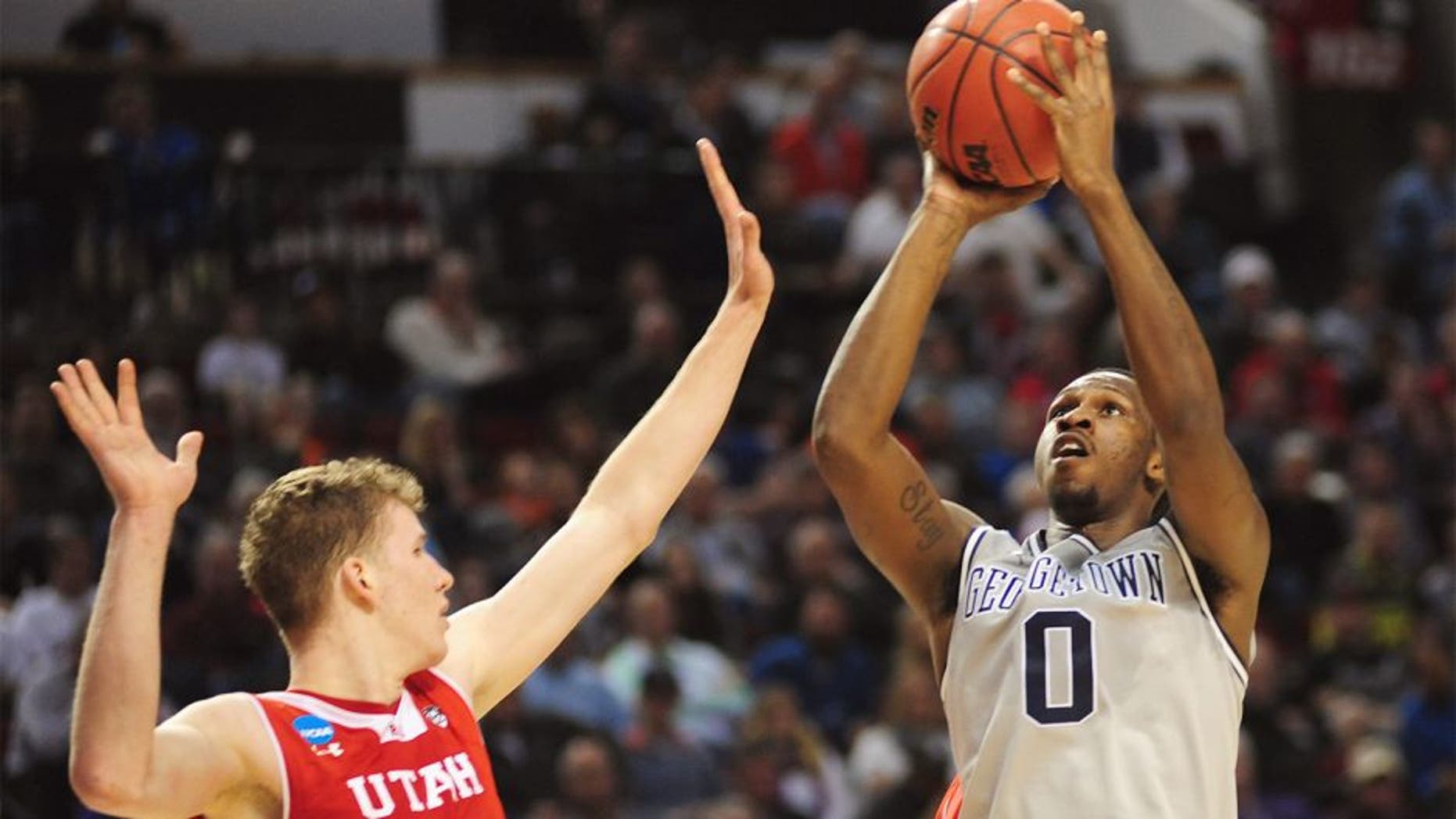 Mar 21, 2015; Portland, OR, USA; Georgetown Hoyas center L.J. Peak (0) shoots the basketball against Utah Utes forward Jakob Poeltl (42) during the first half in the third round of the 2015 NCAA Tournament at Moda Center. Mandatory Credit: Godofredo Vasquez-USA TODAY Sports