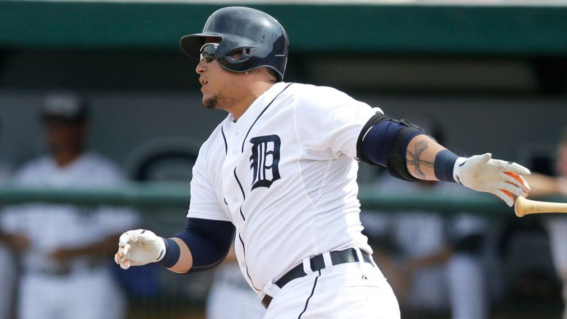 Detroit Tigers' Miguel Cabrera singles to left field during the sixth inning of a spring training exhibition baseball game against the Washington Nationals in Lakeland, Fla., Sunday, March 22, 2015. (AP Photo/Carlos Osorio)