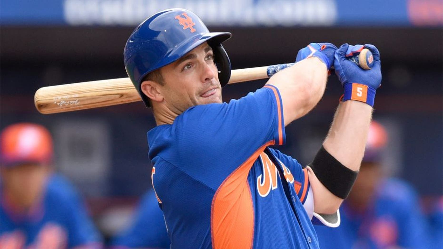 Mar 7, 2015; Port St. Lucie, FL, USA; New York Mets third baseman David Wright (5) hits a double against the Atlanta Braves during the spring training baseball game at Tradition Field. Mandatory Credit: Brad Barr-USA TODAY Sports