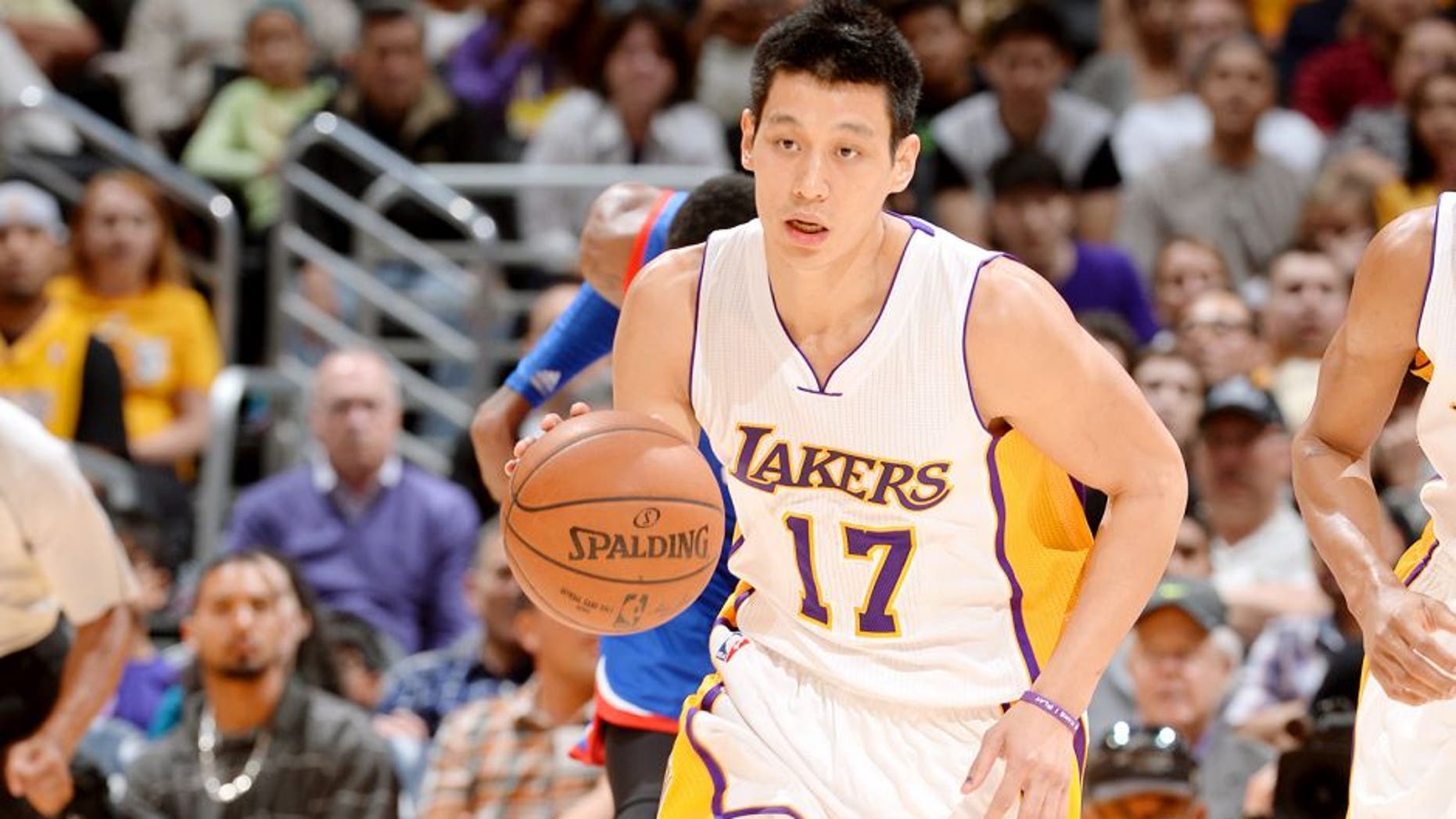 LOS ANGELES, CA - MARCH 22: Jeremy Lin #17 of the Los Angeles Lakers brings the ball up court against the Philadelphia 76ers on March 22, 2015 at Staples Center in Los Angeles, California. NOTE TO USER: User expressly acknowledges and agrees that, by downloading and or using this Photograph, user is consenting to the terms and conditions of the Getty Images License Agreement. Mandatory Copyright Notice: Copyright 2015 NBAE (Photo by Andrew D. Bernstein/NBAE via Getty Images)