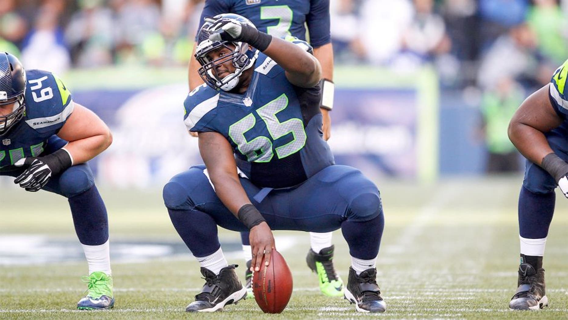 Nov 23, 2014; Seattle, WA, USA; Seattle Seahawks center Patrick Lewis (65) signals for blocking assignments before a snap against the Arizona Cardinals during the second quarter at CenturyLink Field. Mandatory Credit: Joe Nicholson-USA TODAY Sports
