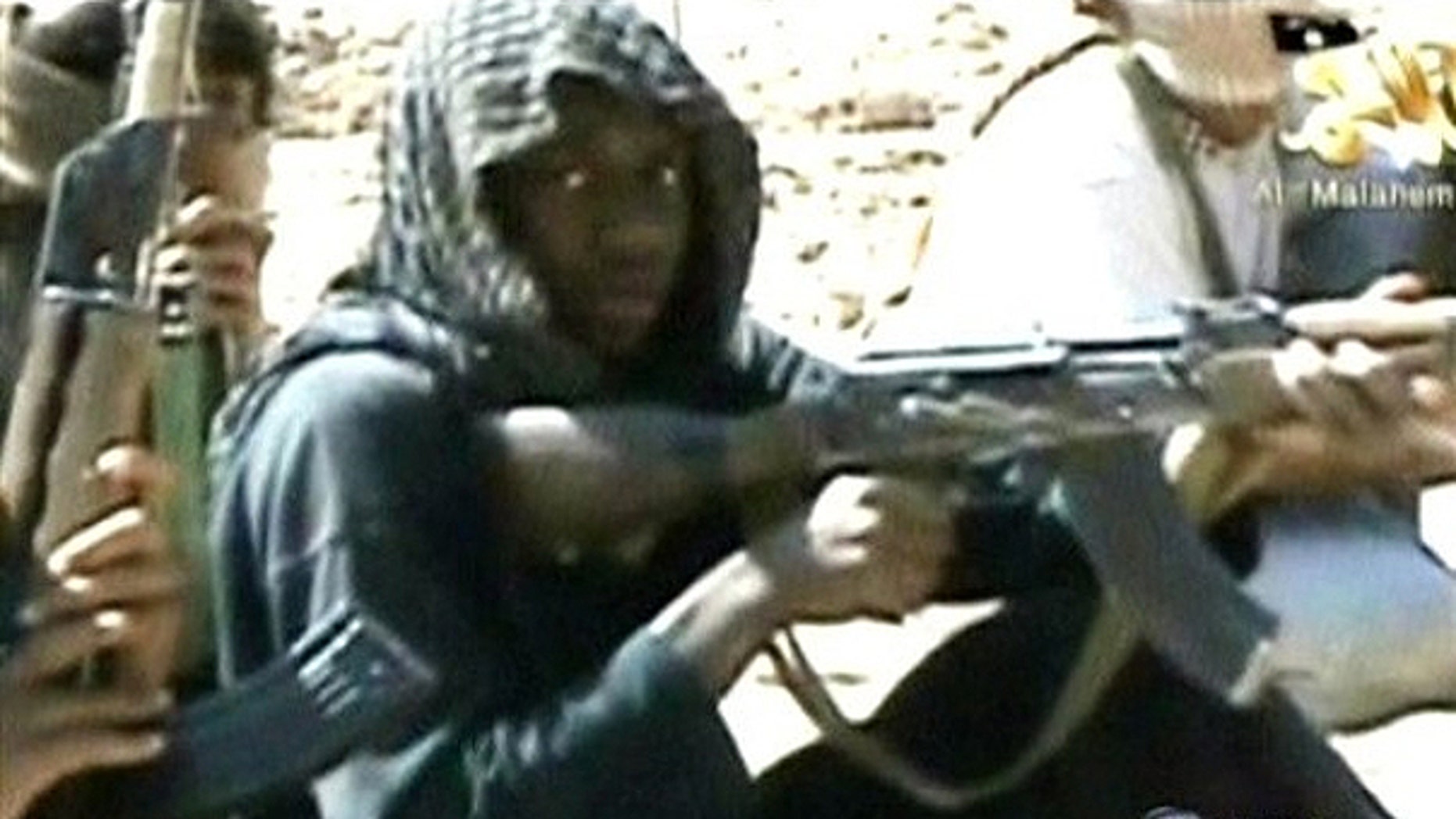In this video still provided by ABC News from a video produced by Al Qaeda, accused underwear bomber Umar Farouk Abdulmutallab and others in his training class fire weapons at a desert camp in Yemen.