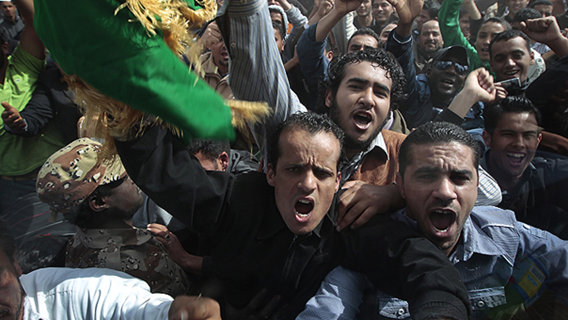March 23: In this image taken during an organized trip by the Libyan authorities, Libyan supporters of Moammar Gadhafi, some of whom came from Tripoli, take part in a staged demonstration in Ban-Waled, home of the Warfallah tribe, 100 miles south east of Tripoli.