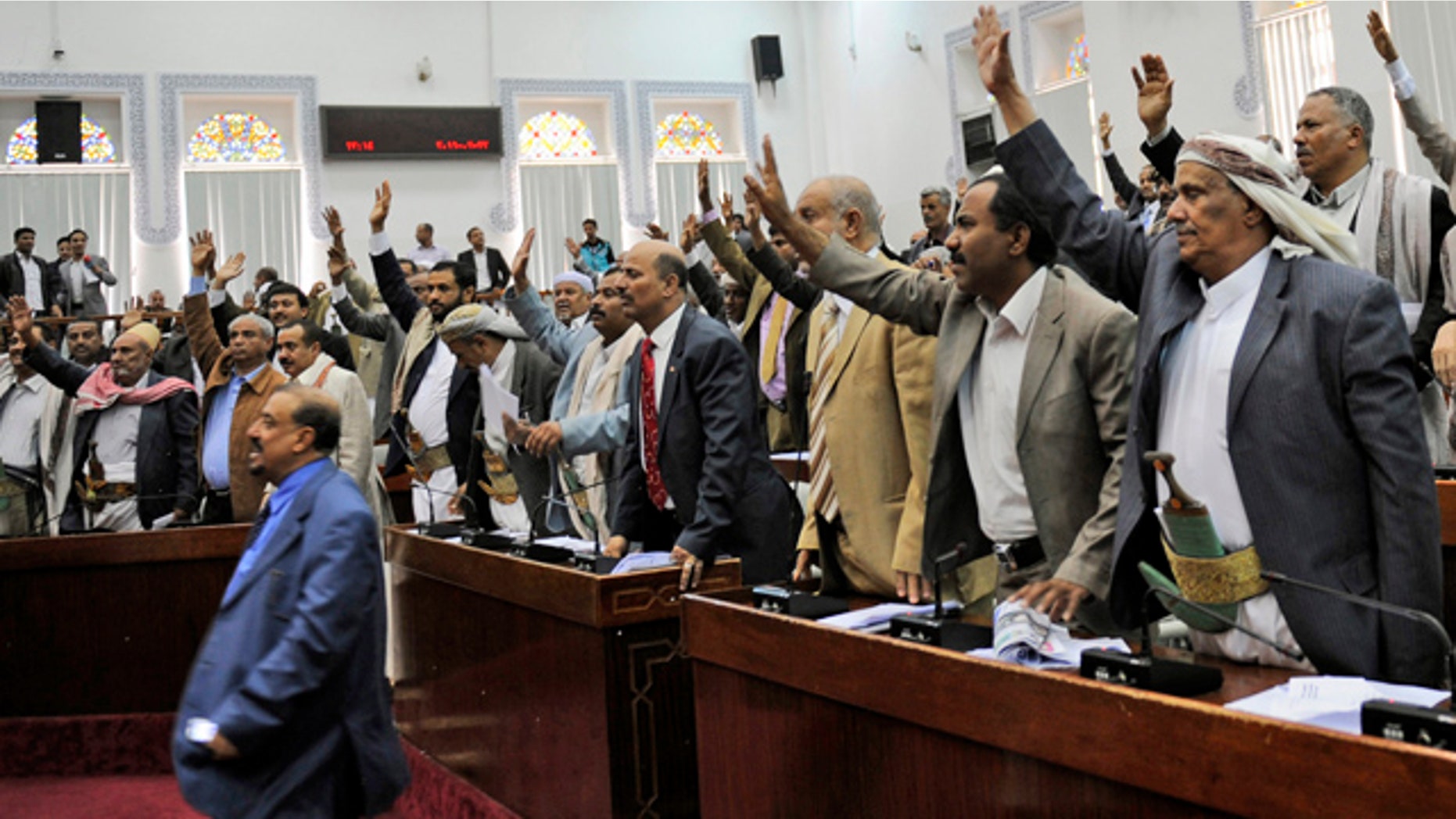 March 23: Members of the Yemeni parliament raise their hands as they vote in favor of the state of emergency during a session in Sanaa, Yemen.