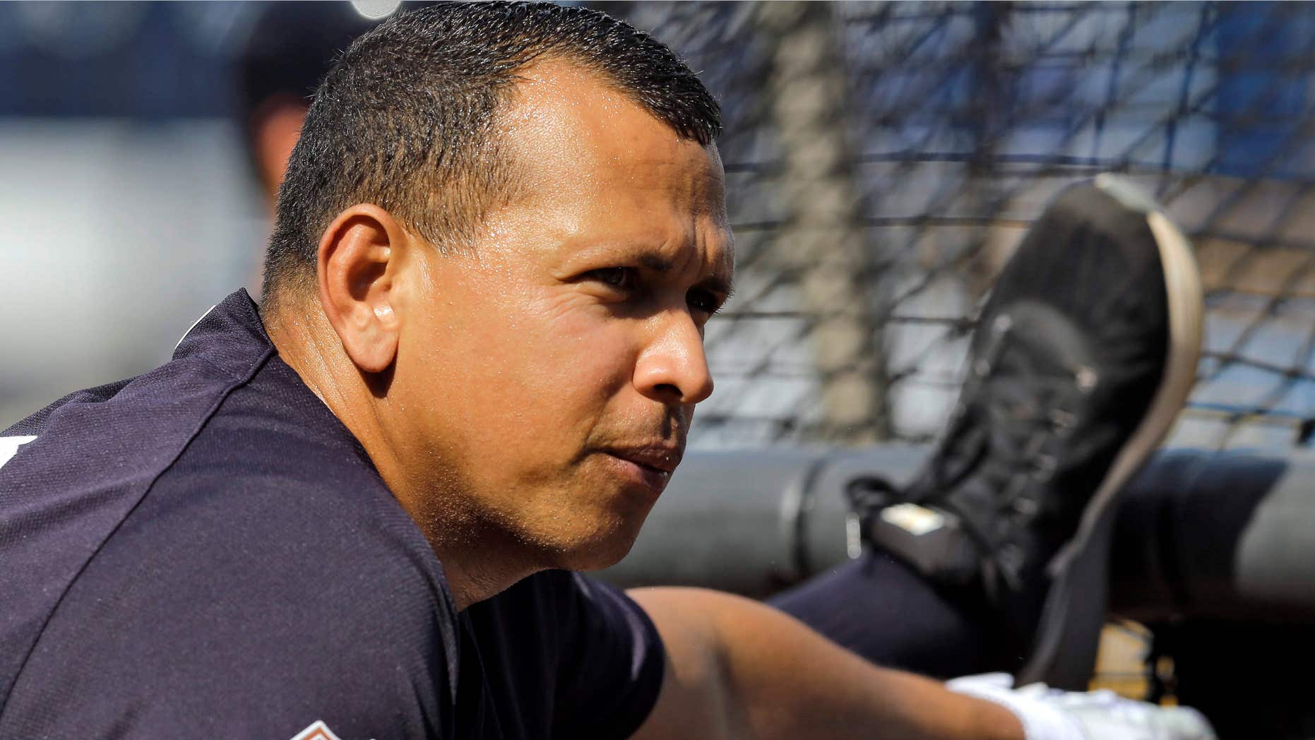 New York Yankees' Alex Rodriguez stretches on the batting cage while warming before a spring training baseball game against the Toronto Blue Jays, Wednesday, March 16, 2016, in Tampa, Fla.