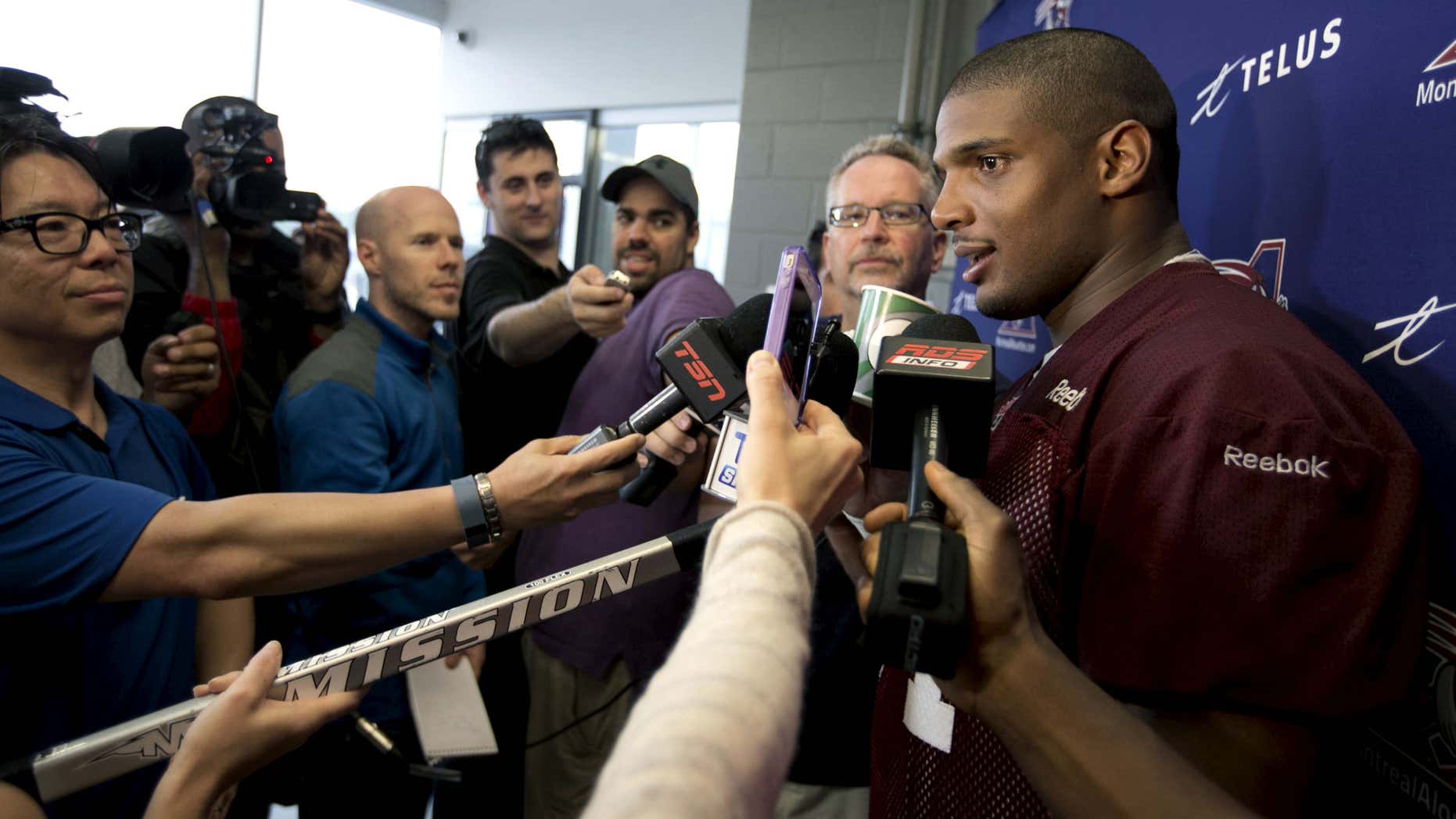 May 27, 2015: Michael Sam, newly signed defensive end for the Montreal Alouettes CFL football team talks to the media following his first day of rookie training camp in Sherbrooke, Quebec .