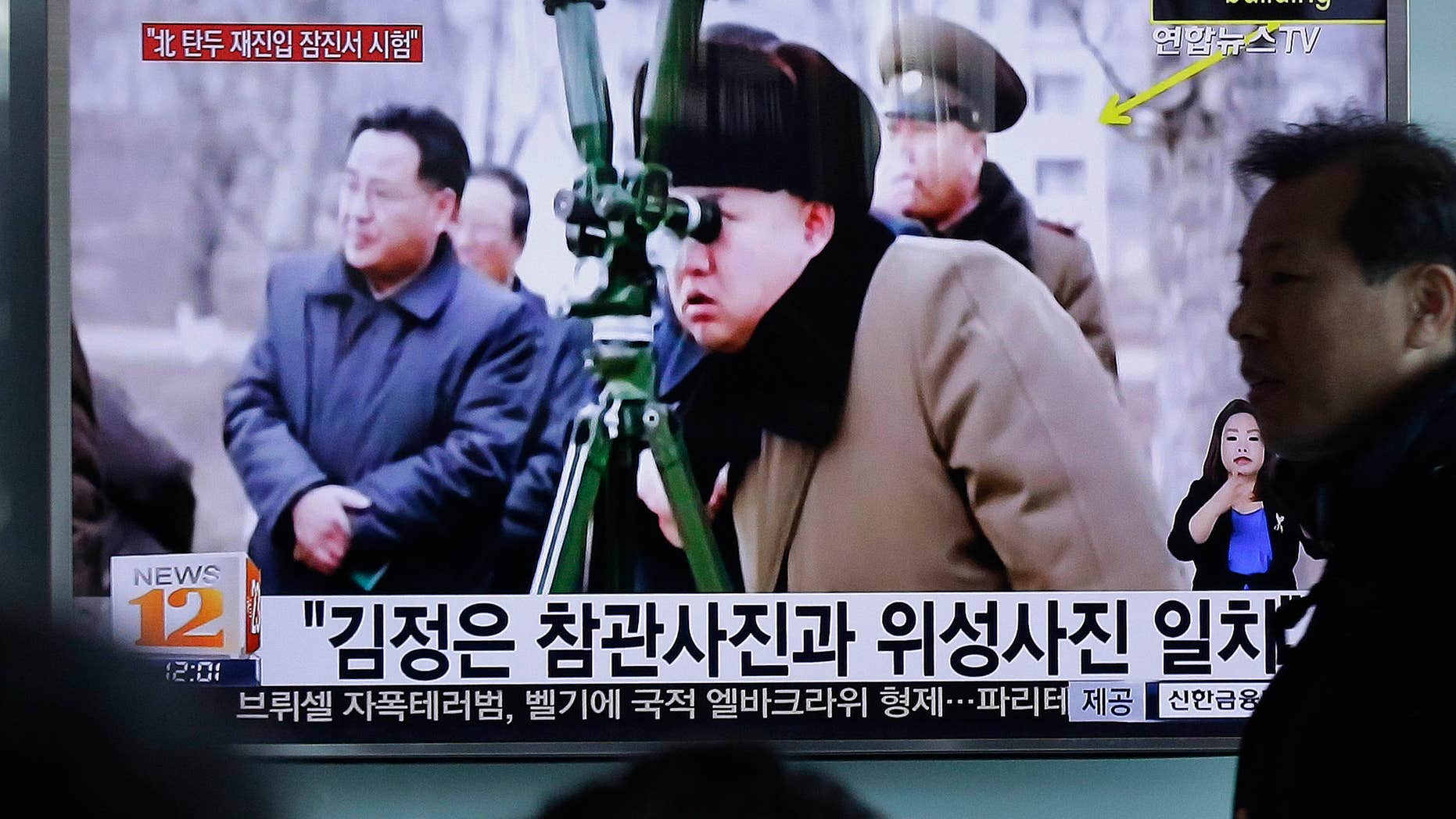 March 24, 2016: A man passes by a TV screen showing North Korean leader Kim Jong Un during a news program at Seoul Railway Station in Seoul, South Korea.
