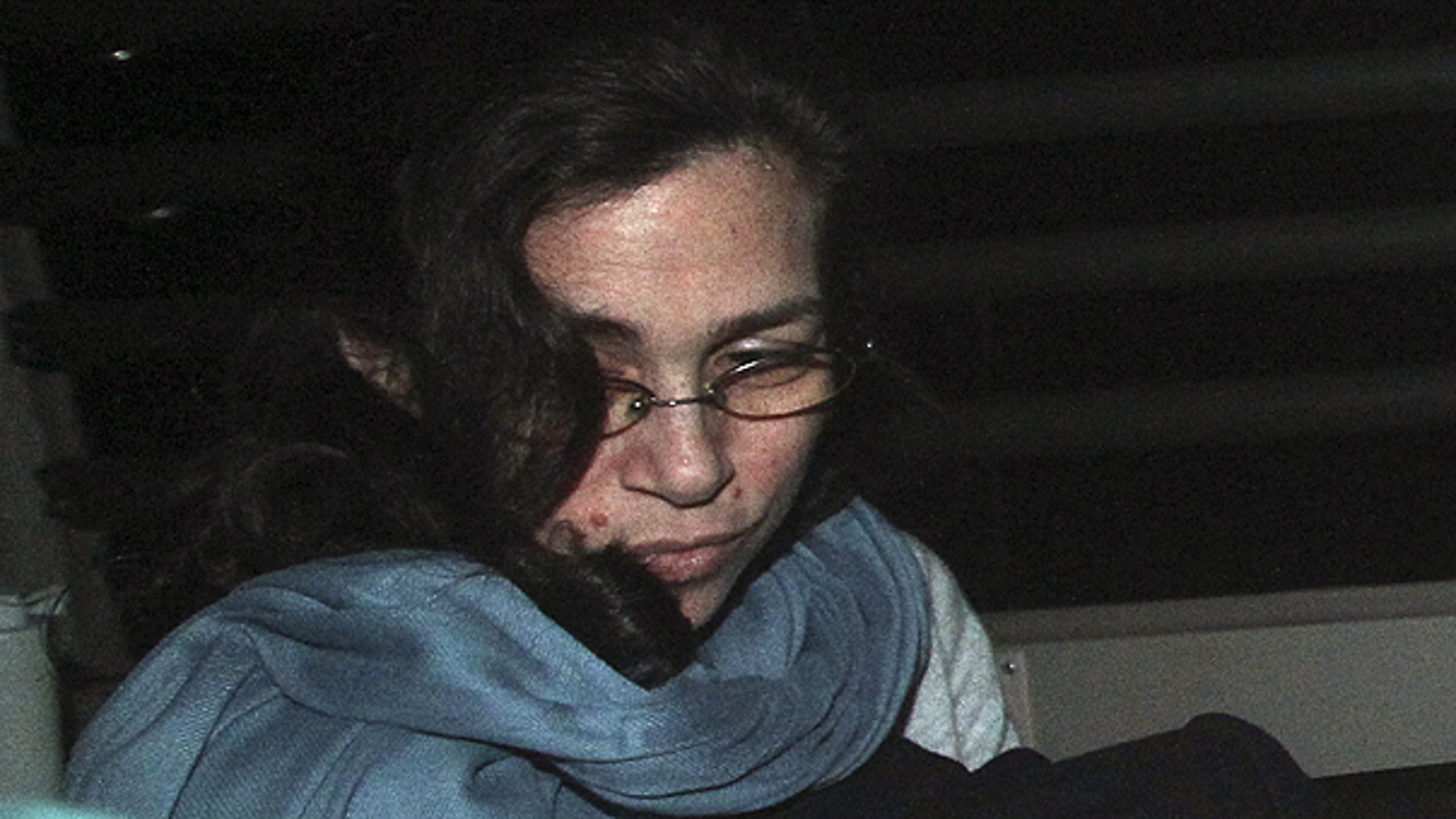 March 24: Nancy Kissel, an American woman accused of killing her husband, leaves the High Court by a prison van in Hong Kong.