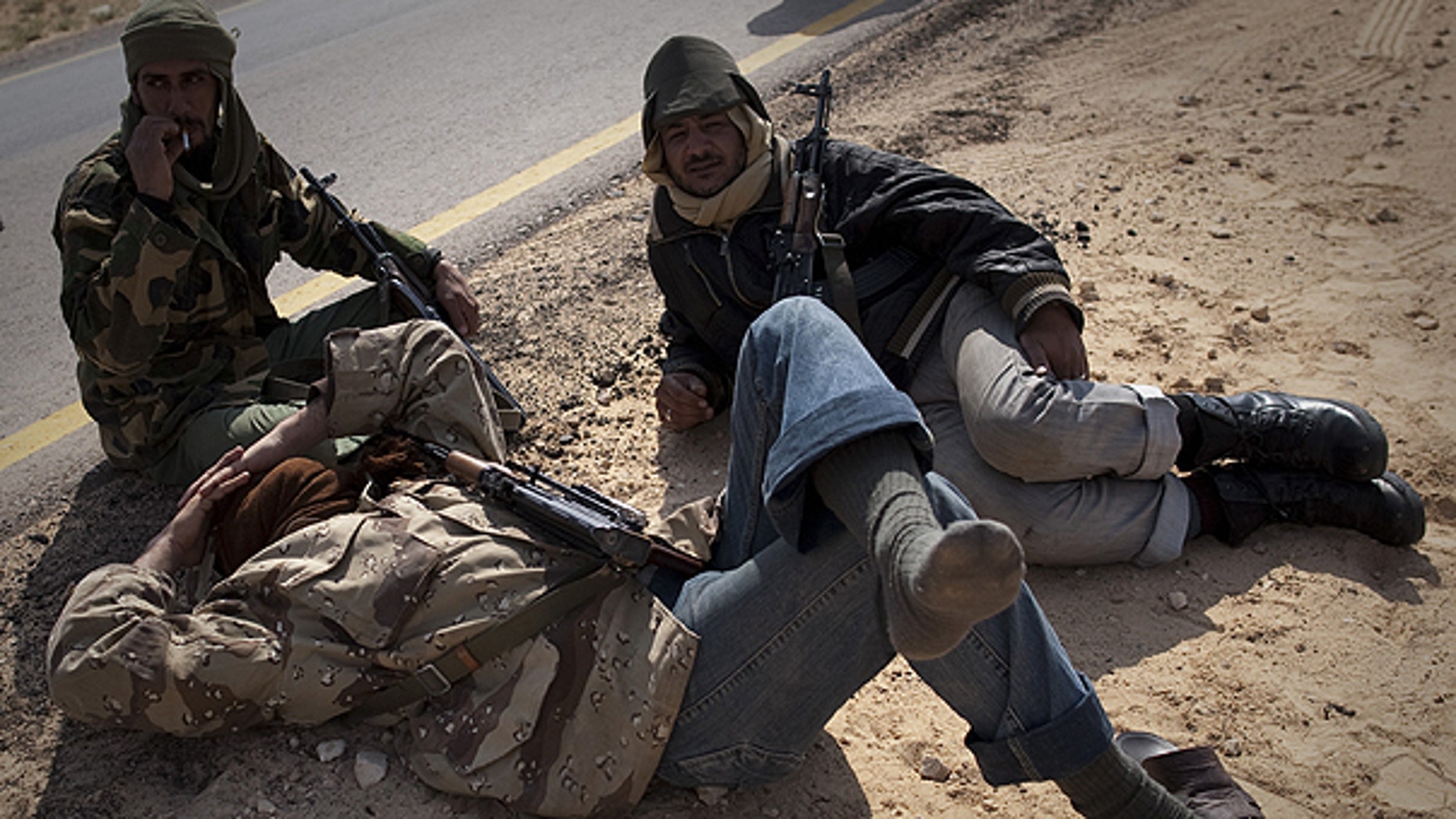 March 24: Libyan rebels take a rest on a checkpoint on the frontline near Zwitina, the outskirts of the city of Ajdabiya, south of Benghazi, eastern Libya.