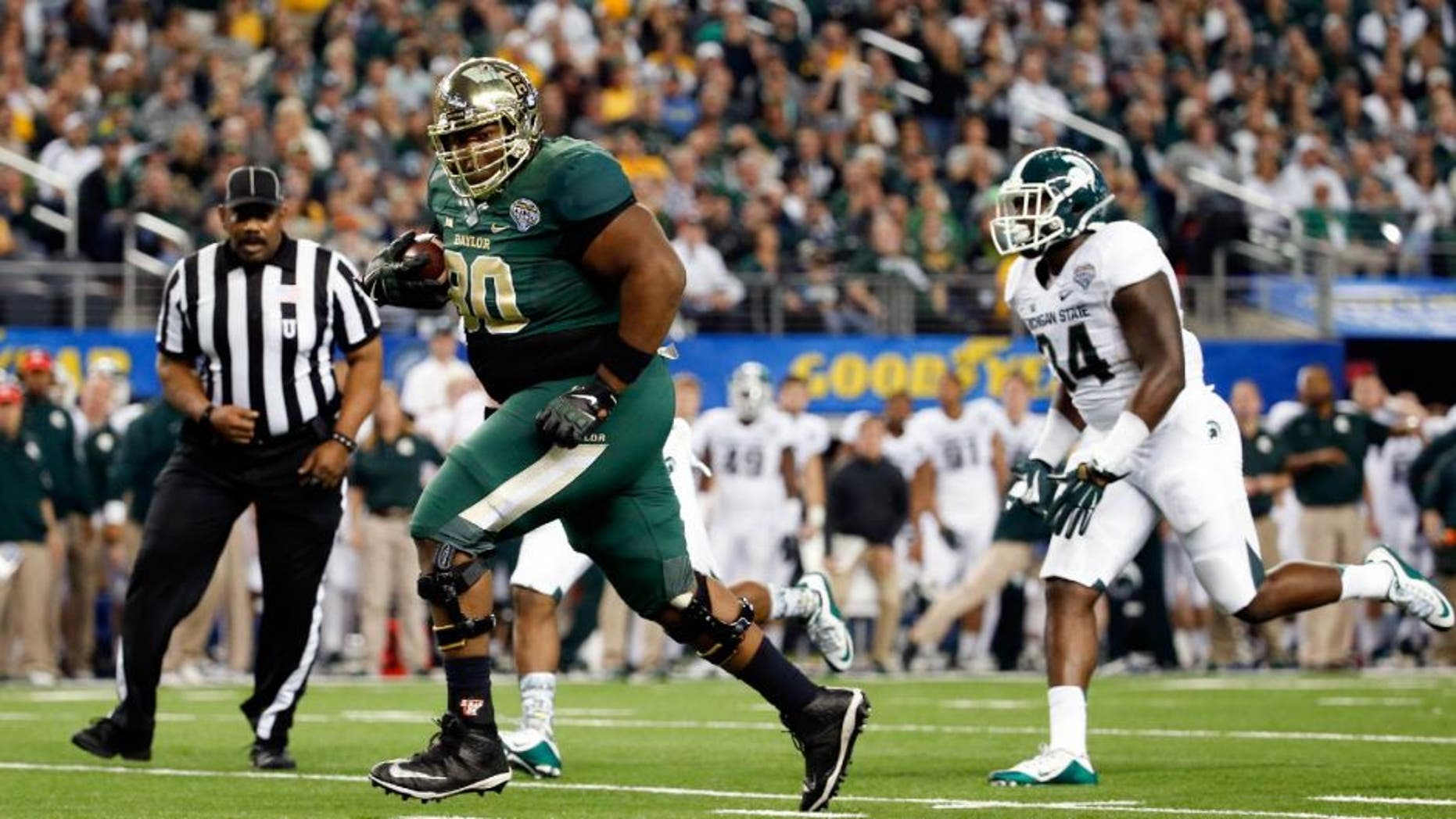 Jan 1, 2015; Arlington, TX, USA; Baylor Bears offensive lineman LaQuan McGowan (80) scores a touchdown during the game against the Michigan State Spartans in the 2015 Cotton Bowl Classic at AT&T Stadium. Mandatory Credit: Kevin Jairaj-USA TODAY Sports