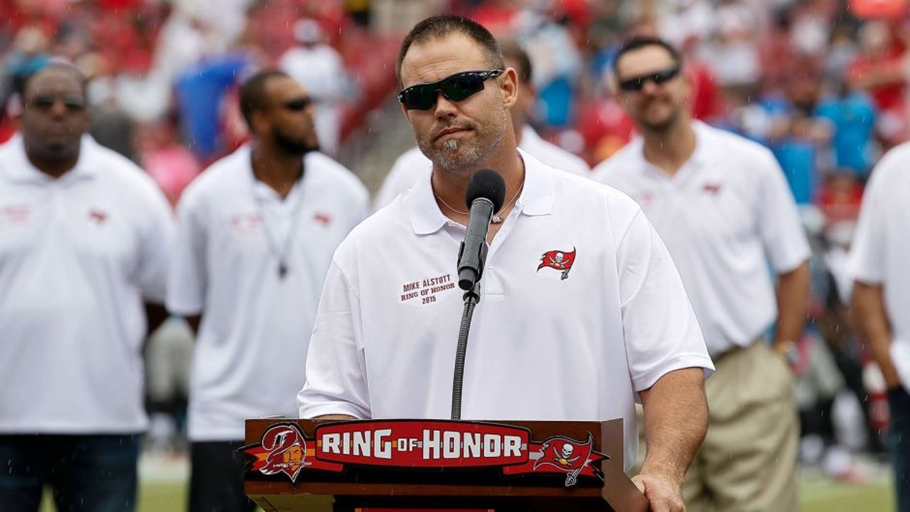 TAMPA, FL - OCTOBER 4: Former Runningback Mike Alstott of the Tampa Bay Buccaneers adresses the fans as he is being honored by being placed in the Ring of Honor during halftime against the Carolina Panthers at Raymond James Stadium on October 4, 2015 in Tampa, Florida. Alstott played his entire 12 year career with the Buccaneers from 1996 to 2007. Panthers defeated the Buccaneers 37 to 23. (Photo by Don Juan Moore/Getty Images)