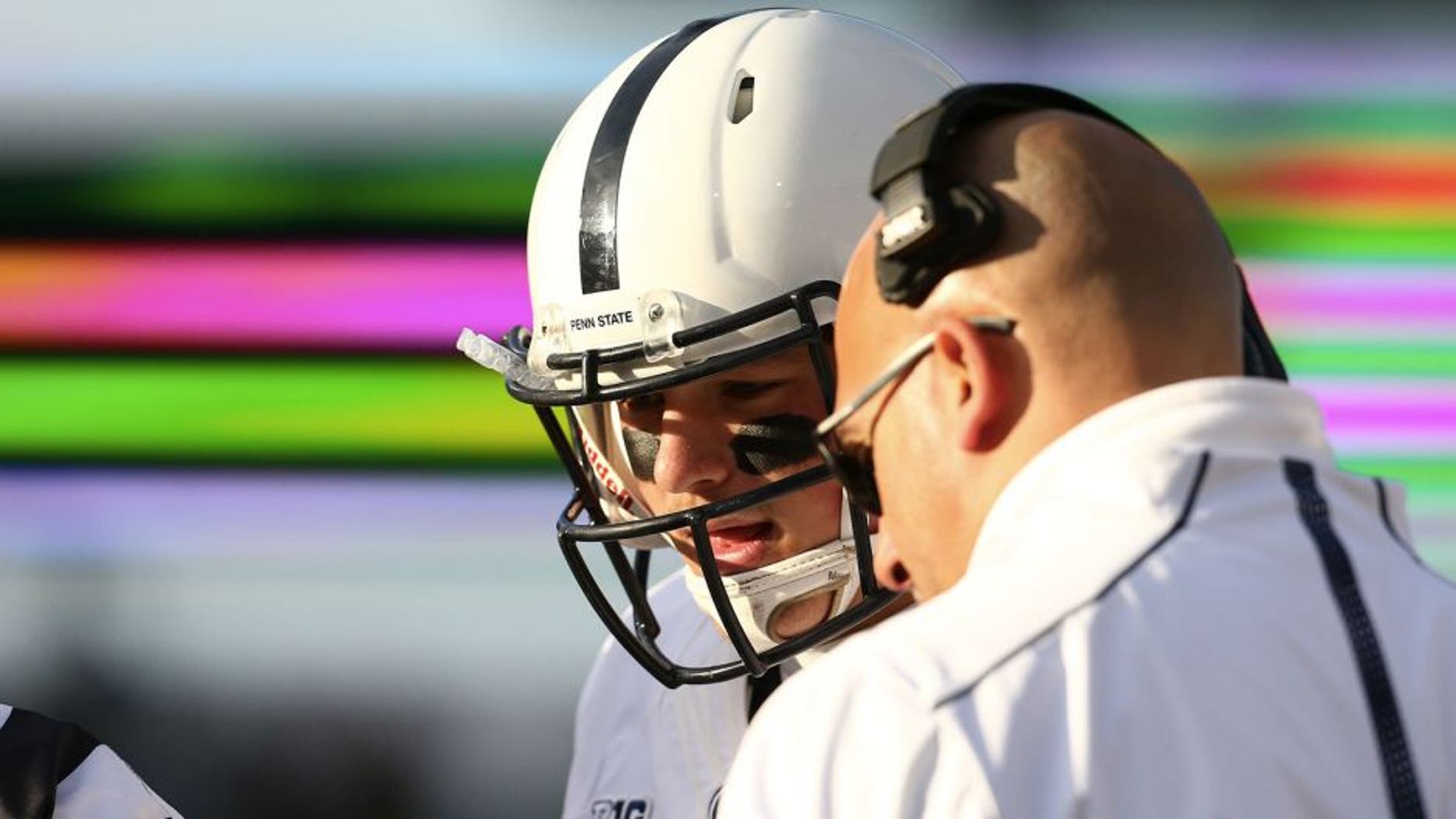EAST LANSING, MI - NOVEMBER 28: Head coach James Franklin of the Penn State Nittany Lions talks with Christian Hackenberg #14 of the Penn State Nittany Lions on the sideline in the first quarter during the game against the Michigan State Spartans at Spartan Stadium on November 28, 2015 in East Lansing, Michigan. (Photo by Rey Del Rio/Getty Images)