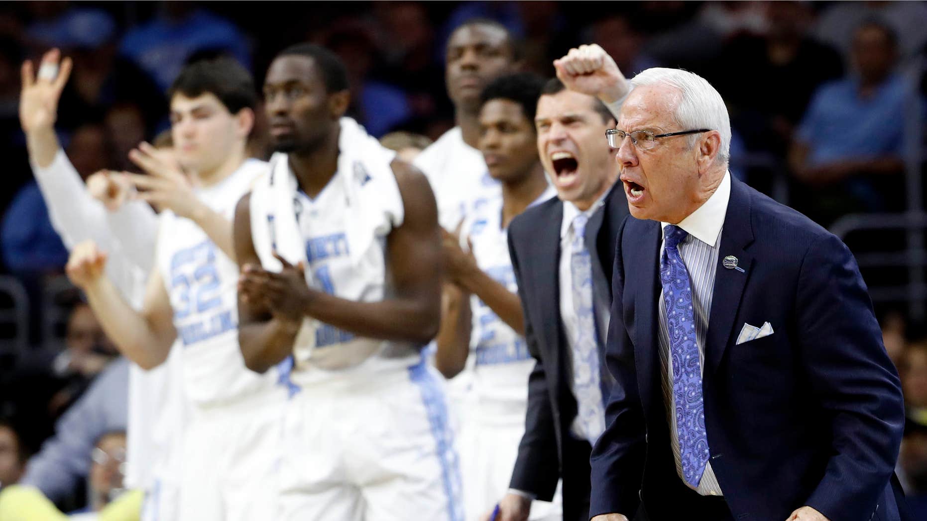 North Carolina coach Roy Williams and players react during the second half of the team's college basketball game against Indiana in the regional semifinals of the men's NCAA Tournament, early Saturday, March 26, 2016, in Philadelphia.