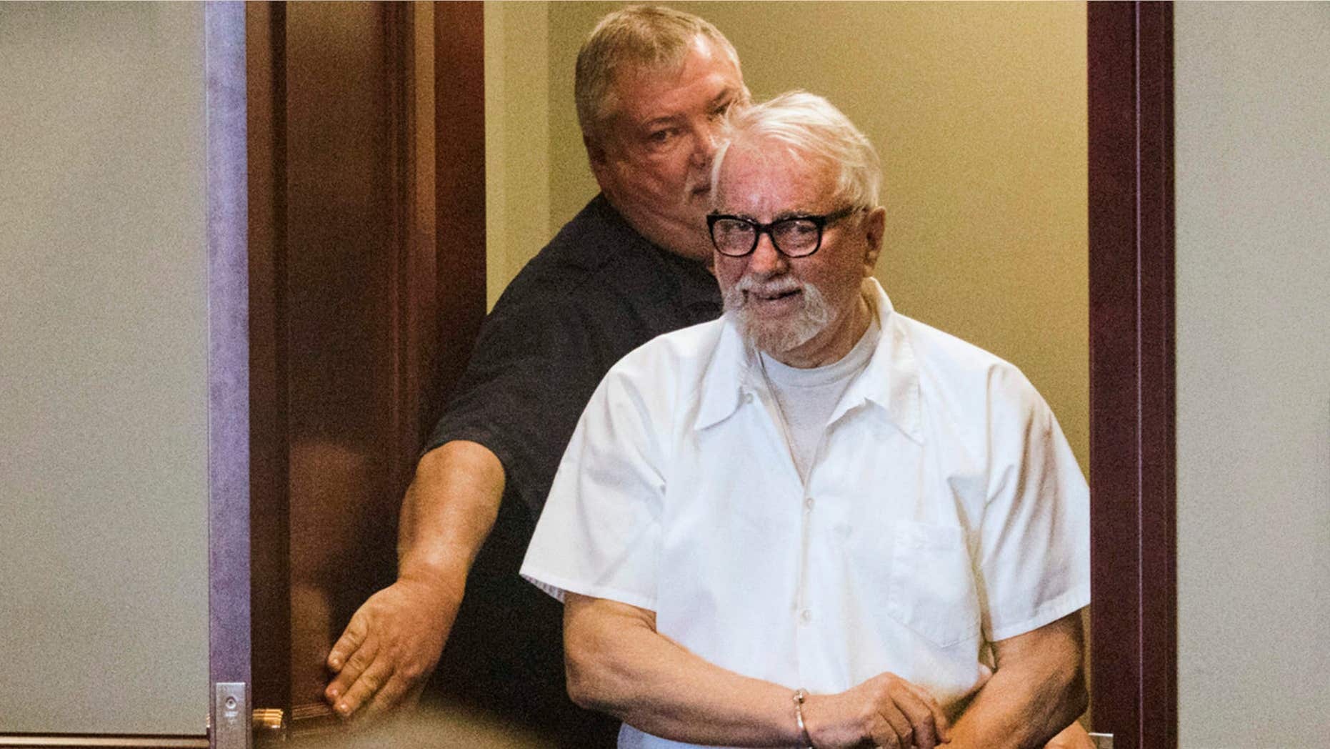 FILE - In this Jan. 14, 2016 file photo, convicted murderer Jack McCullough walks into the DeKalb County Courthouse in Sycamore, Ill., to request post-conviction relief.